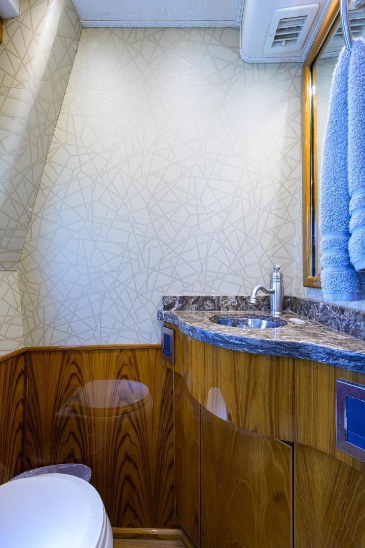 a bathroom with a sink and a mirror aboard TORO Yacht for Sale