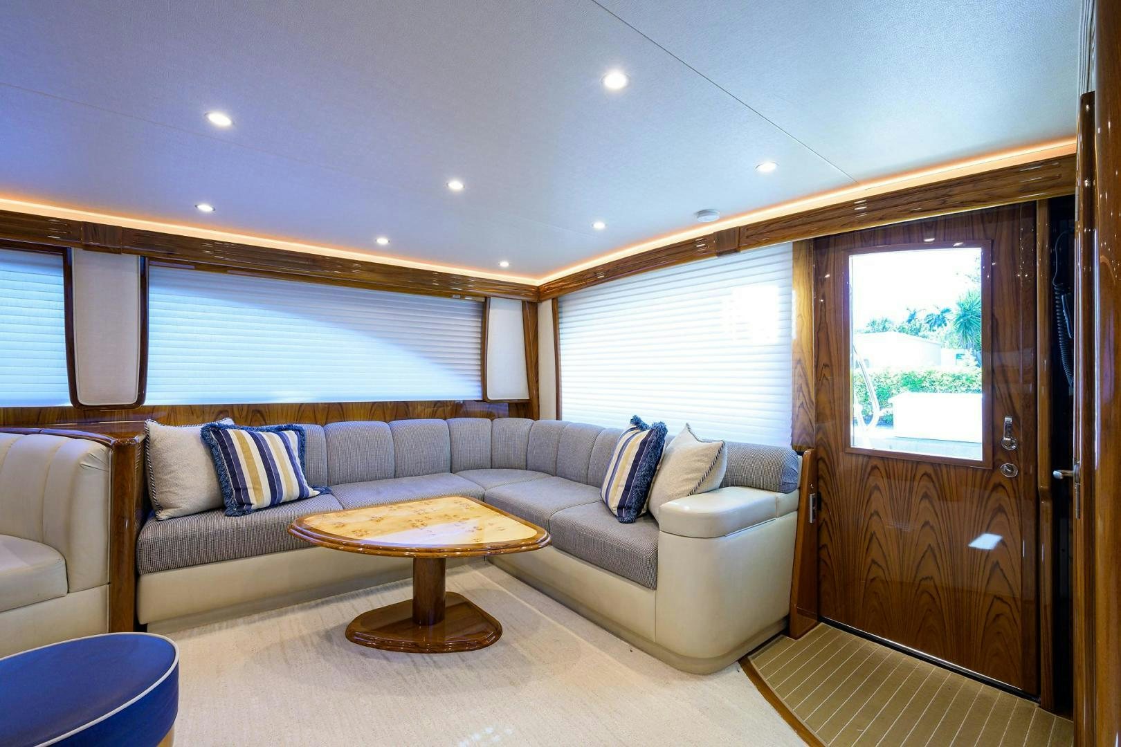 a living room with a couch and a table aboard TORO Yacht for Sale