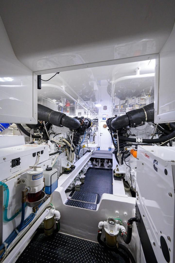 a white vehicle with a large engine aboard TORO Yacht for Sale