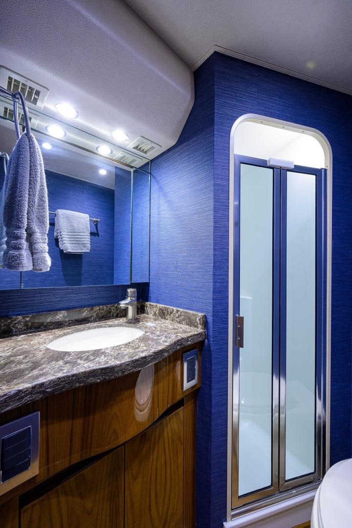 a bathroom with a sink and a mirror aboard TORO Yacht for Sale