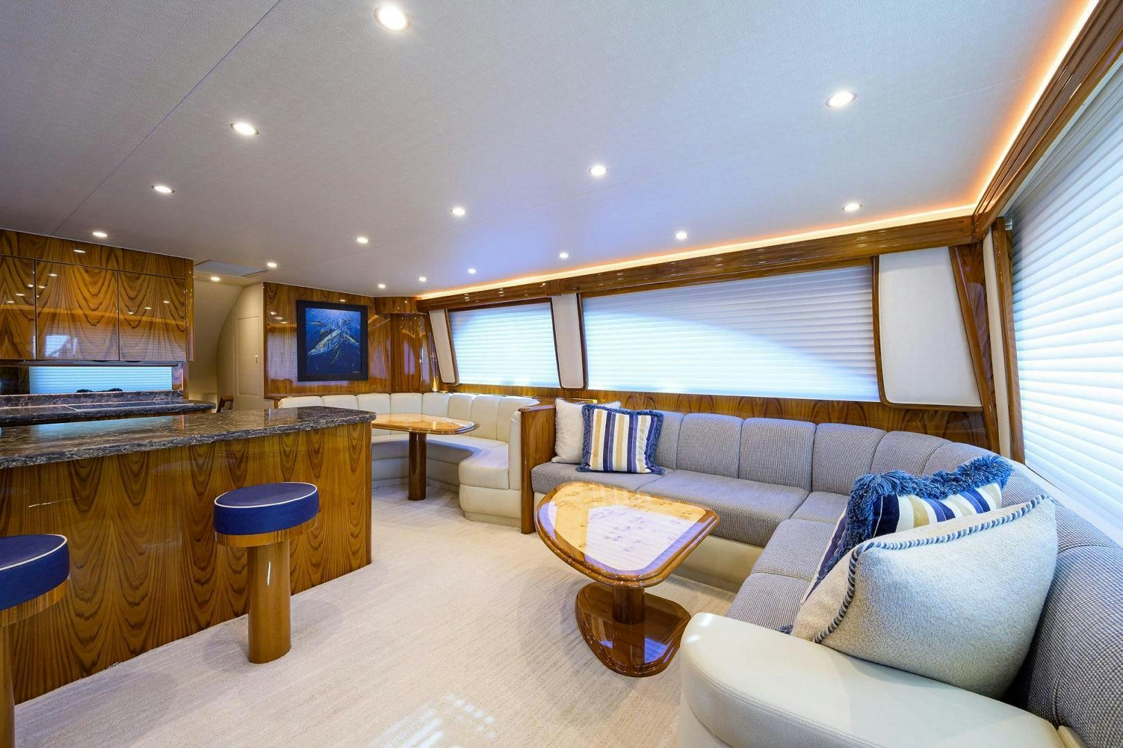 a living room with a couch and a table aboard TORO Yacht for Sale
