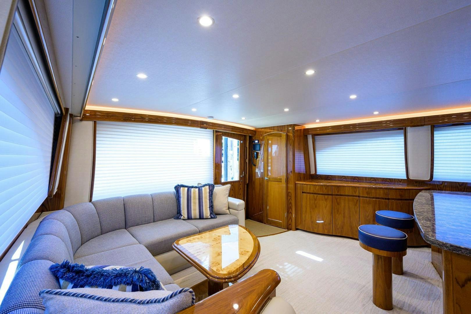 a living room with a couch and a table aboard TORO Yacht for Sale