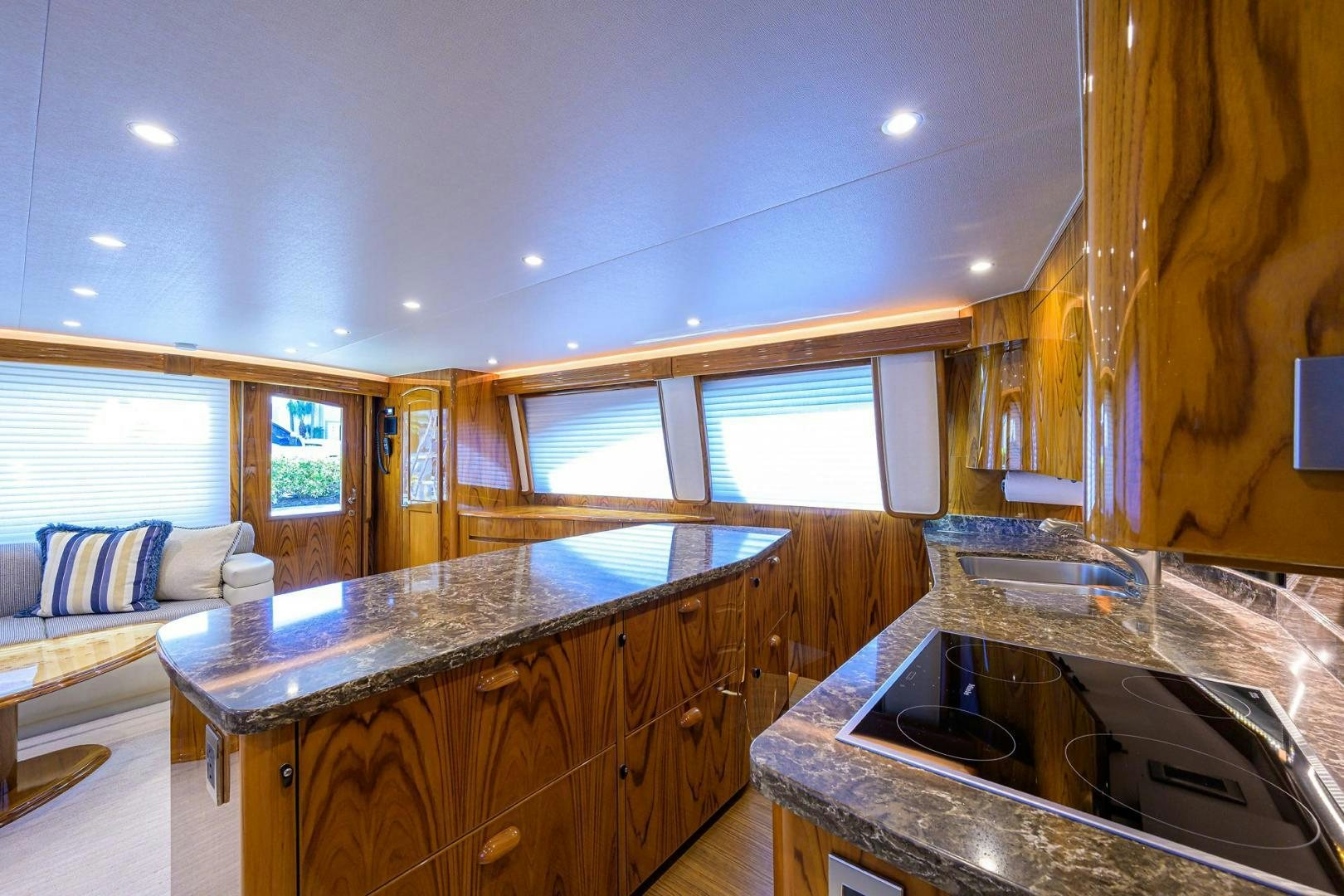a kitchen with a bed and a couch aboard TORO Yacht for Sale