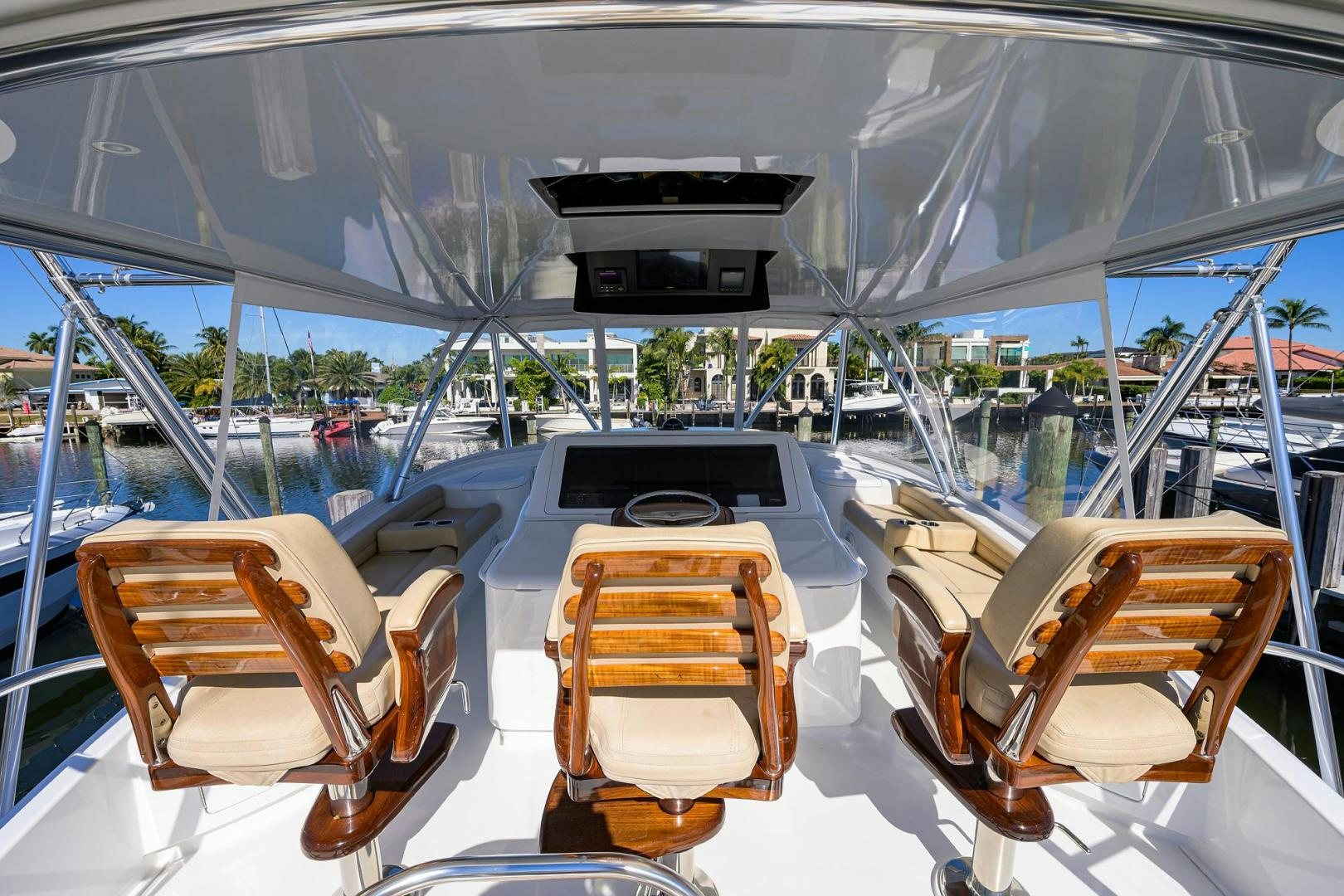 a boat with chairs and a table on it aboard TORO Yacht for Sale