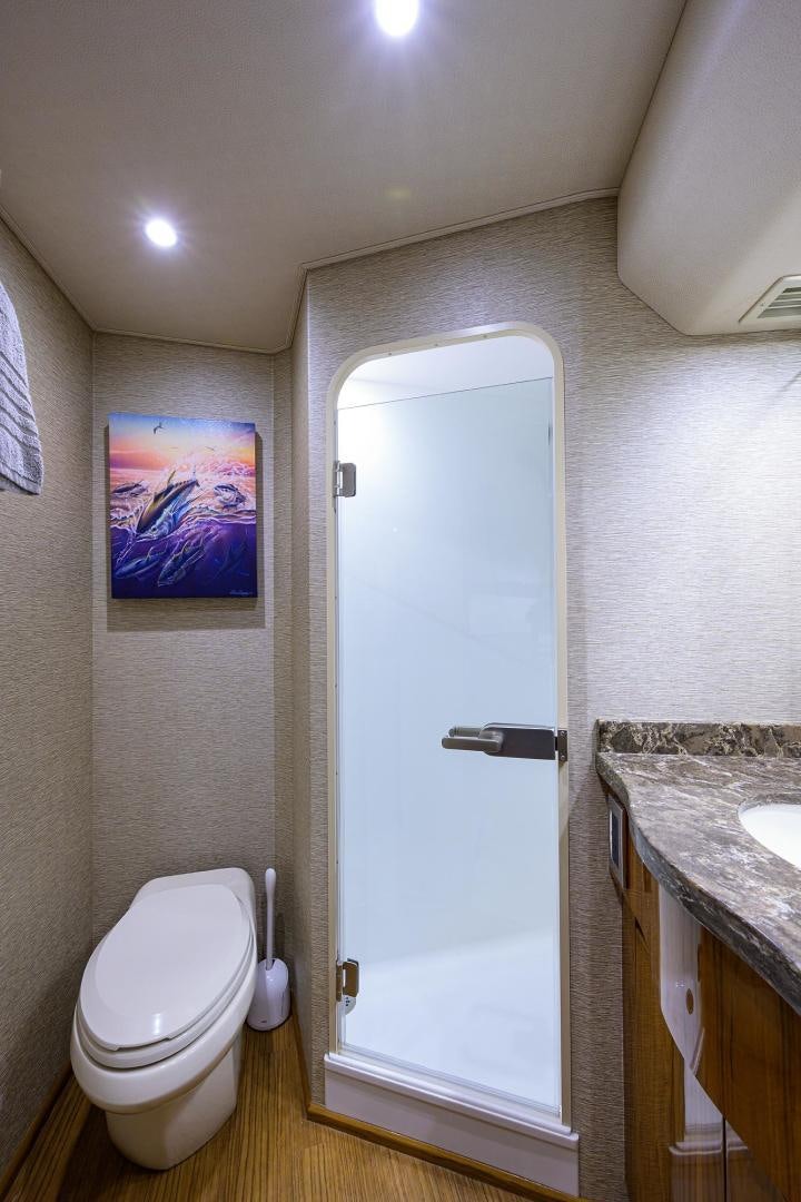 a bathroom with a toilet and a sink aboard TORO Yacht for Sale