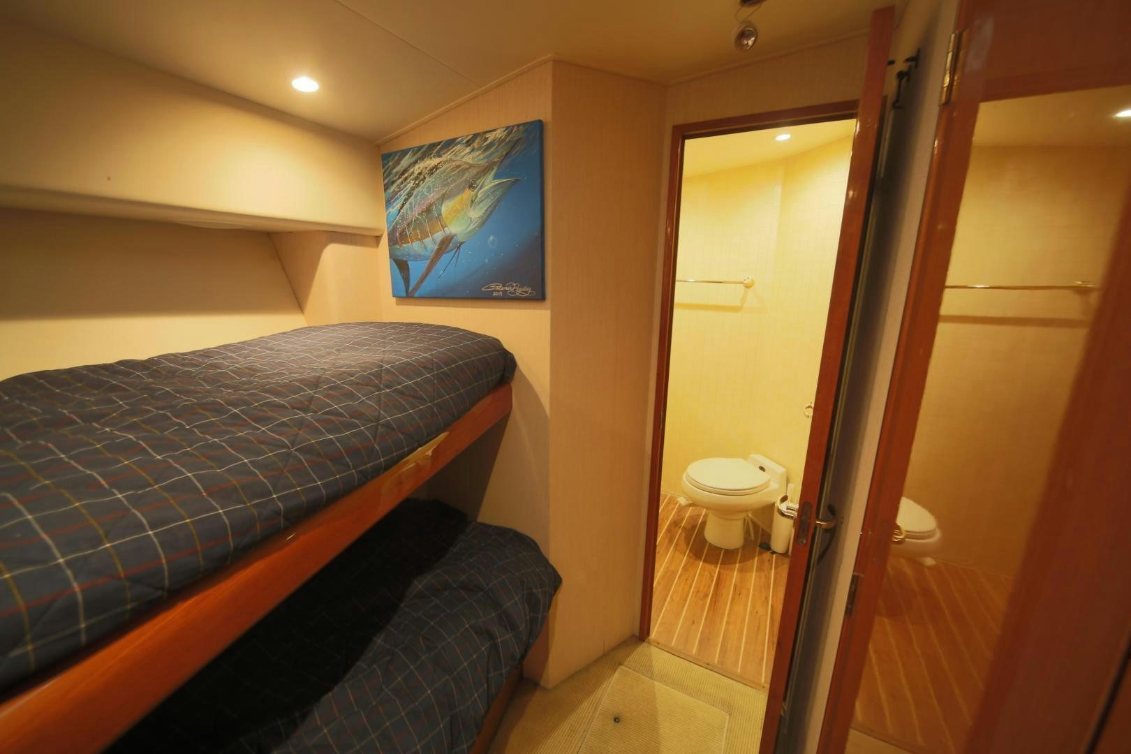 a bedroom with a bed and a closet aboard LUCILLE Yacht for Sale