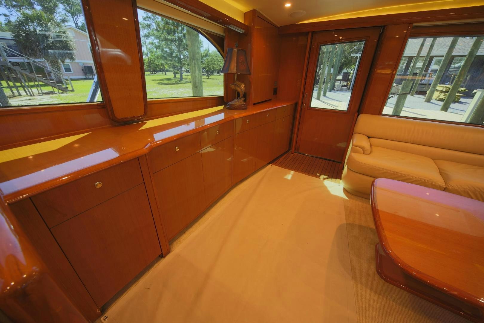 a room with wooden cabinets and a couch aboard LUCILLE Yacht for Sale