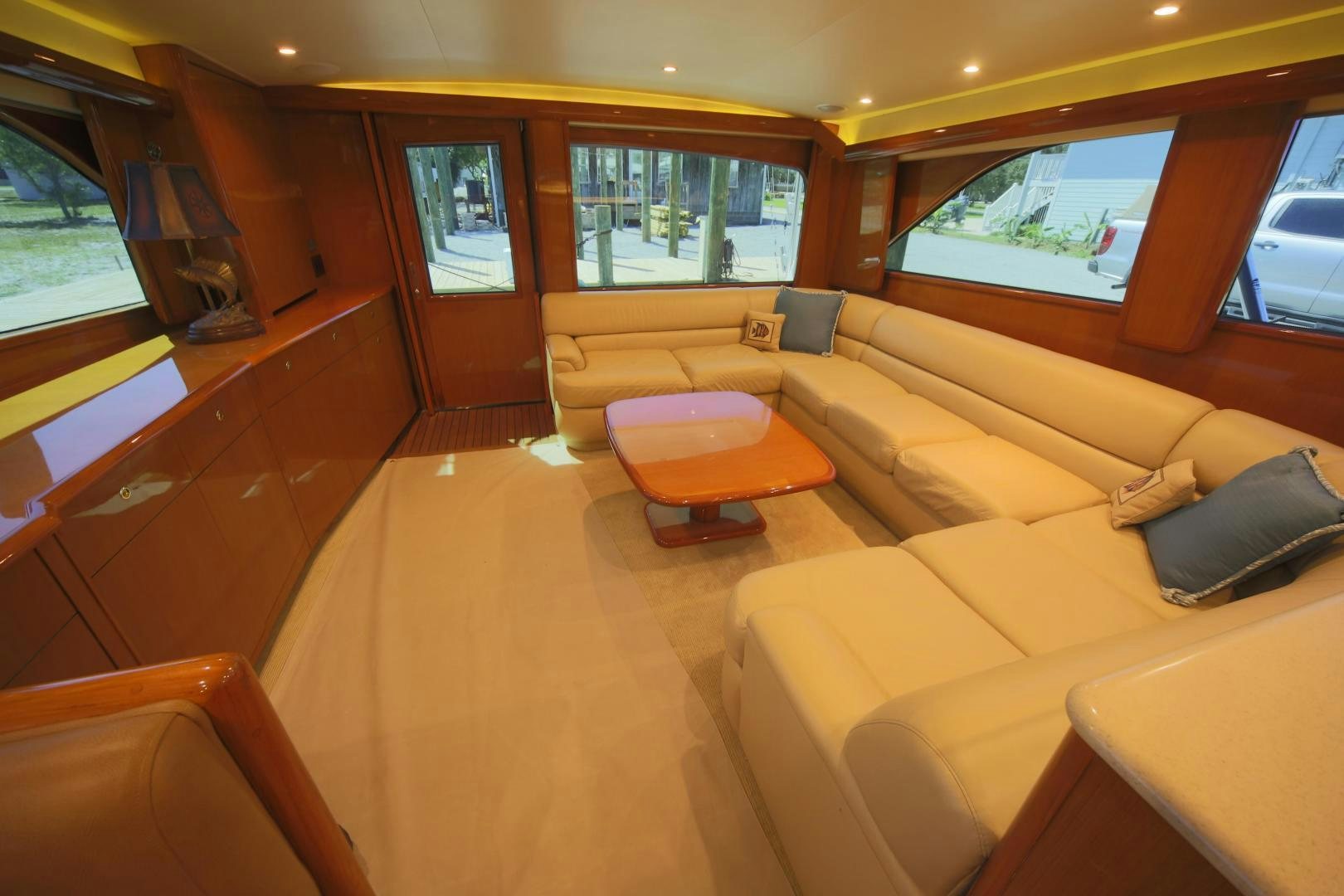 a living room with a couch and a table aboard LUCILLE Yacht for Sale
