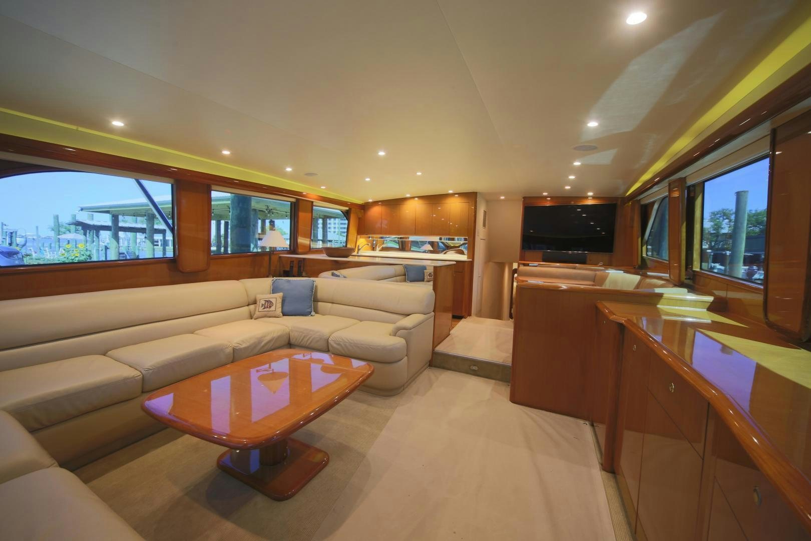 a living room with a couch and a coffee table aboard LUCILLE Yacht for Sale