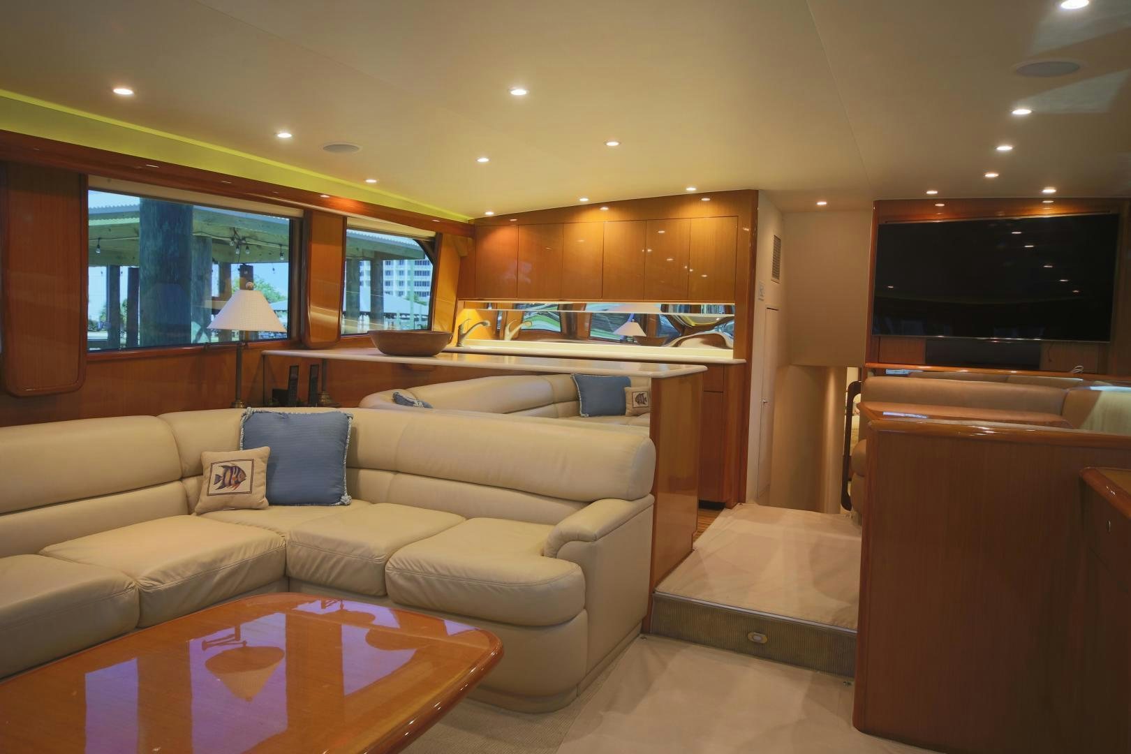 a living room with a couch and a television aboard LUCILLE Yacht for Sale