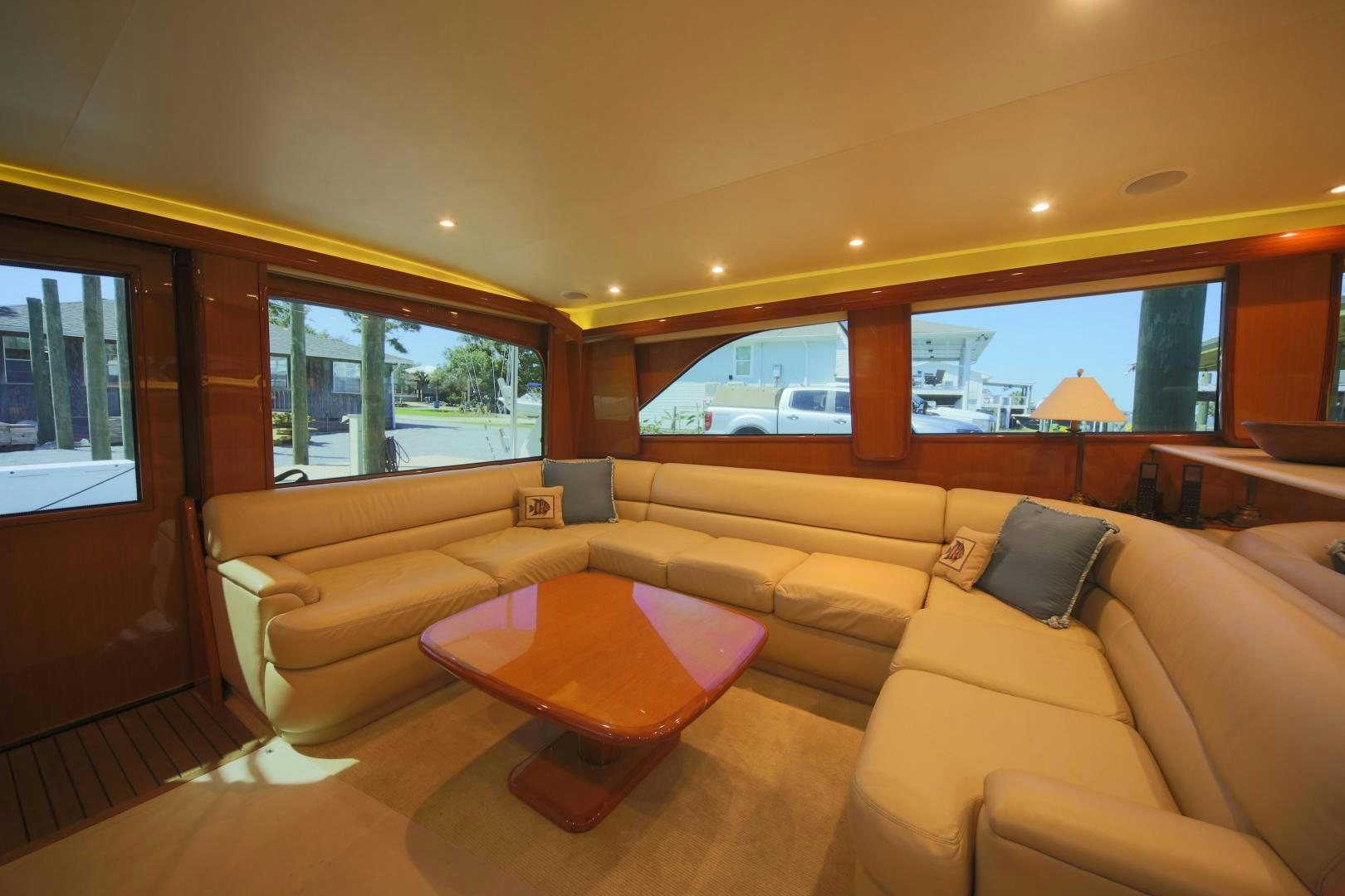a living room with a couch and a table aboard LUCILLE Yacht for Sale