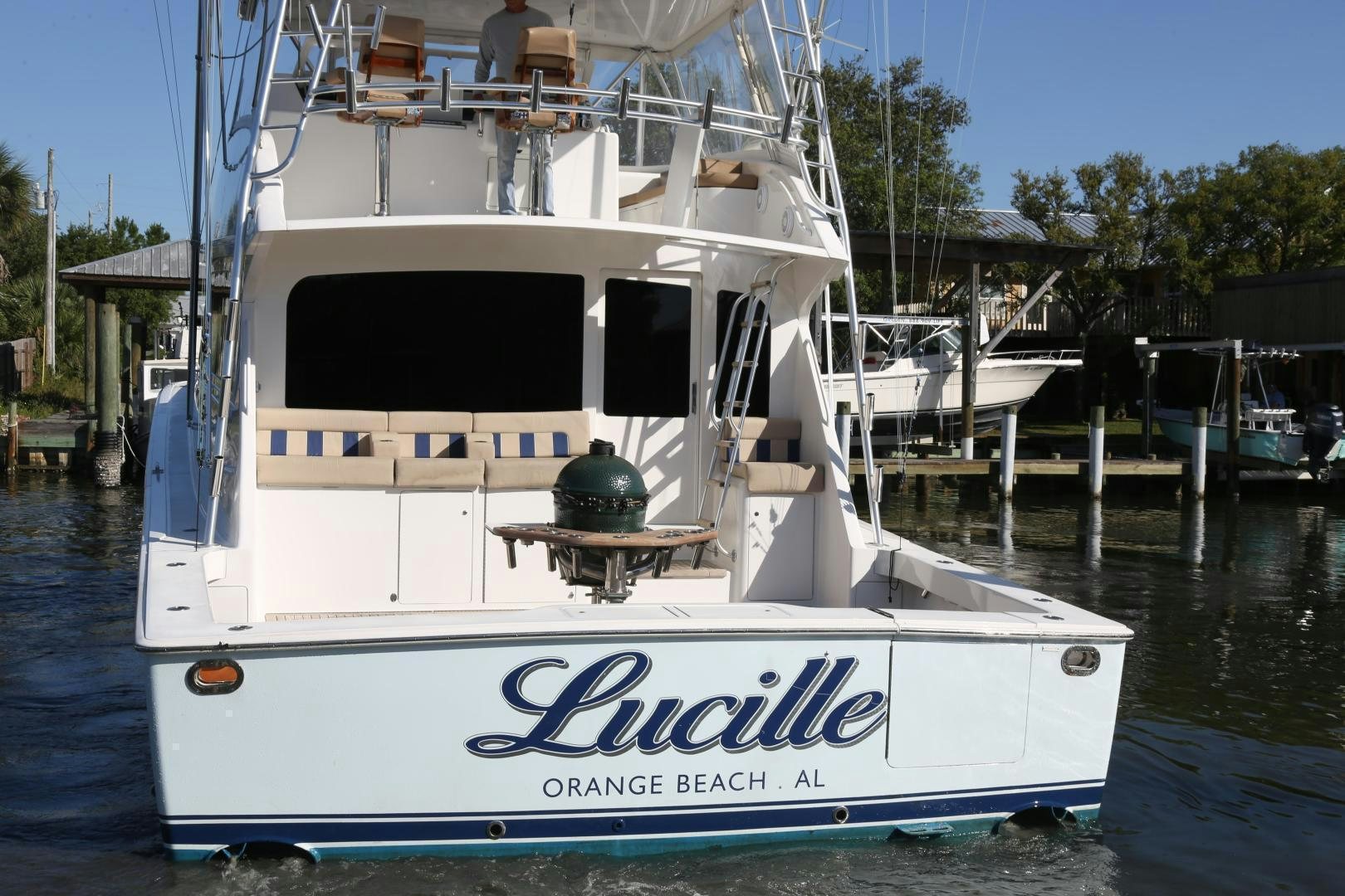 a white boat docked aboard LUCILLE Yacht for Sale