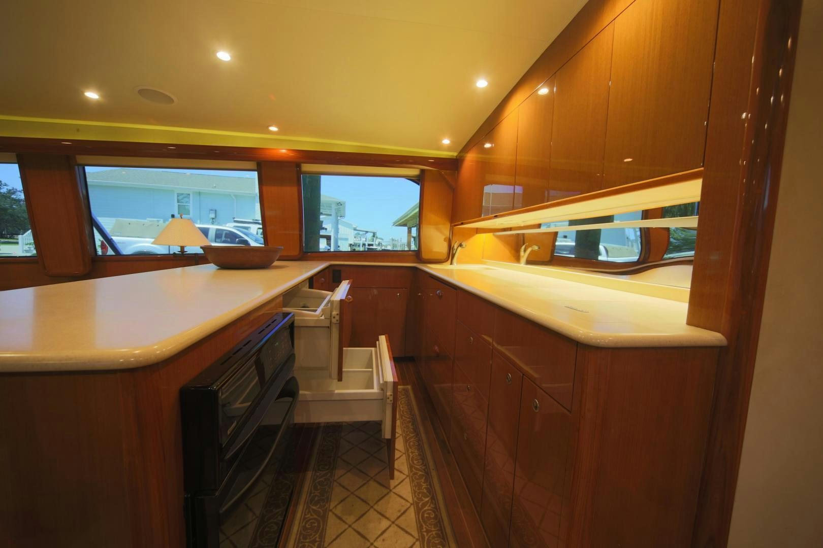a kitchen with a sink and a microwave aboard LUCILLE Yacht for Sale