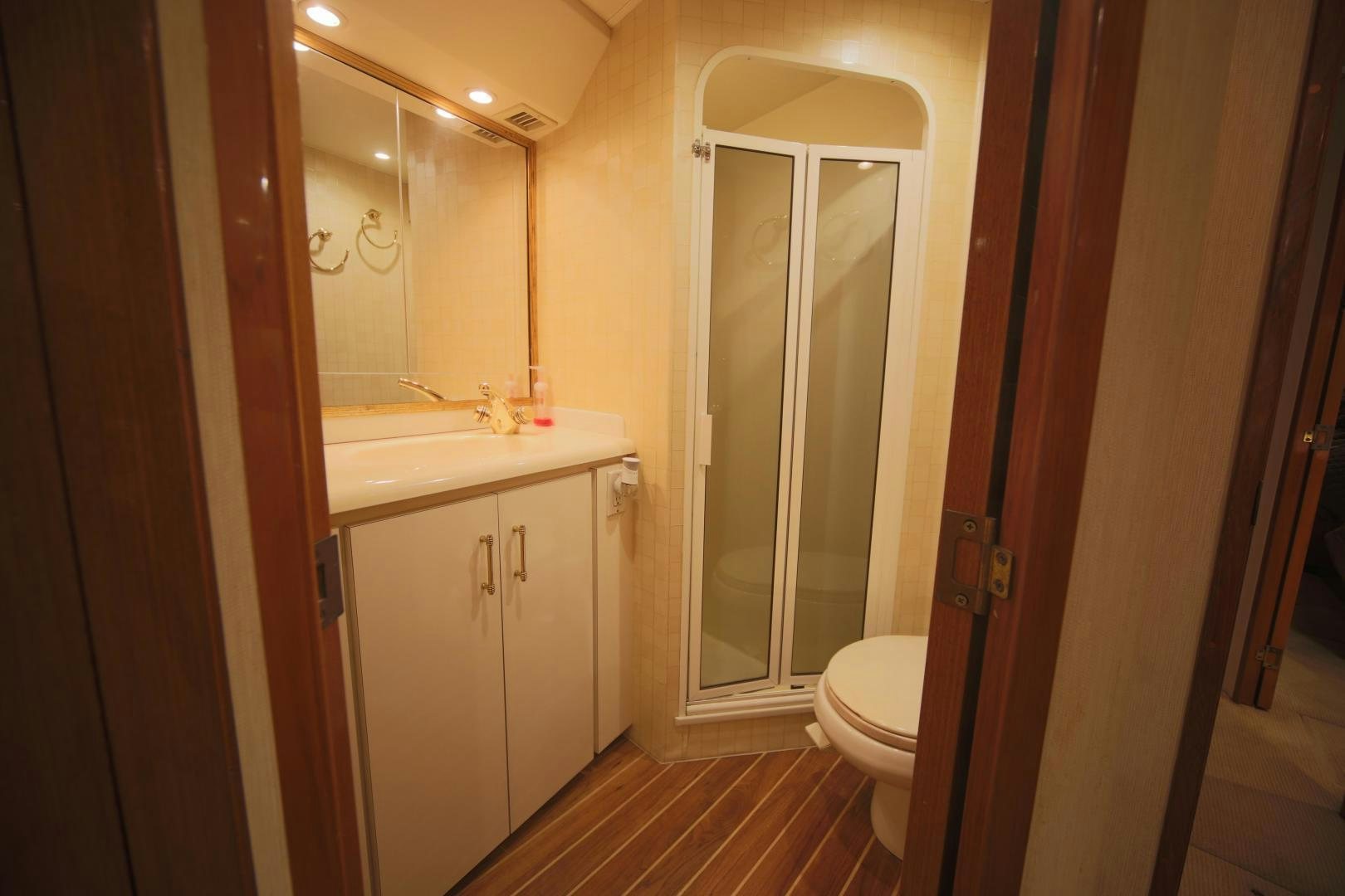 a bathroom with a sink and a toilet aboard LUCILLE Yacht for Sale