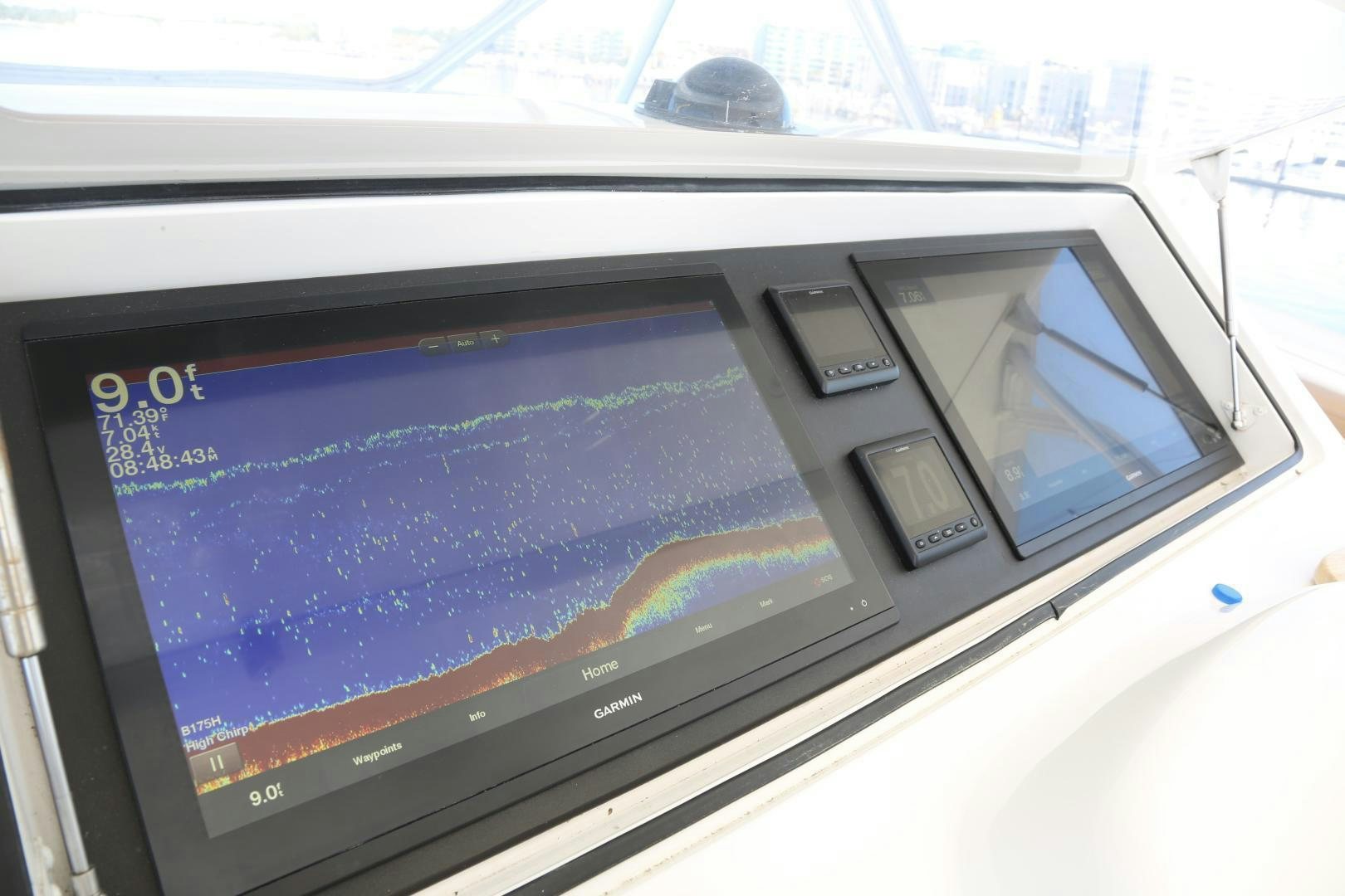 a tablet on a dashboard aboard LUCILLE Yacht for Sale