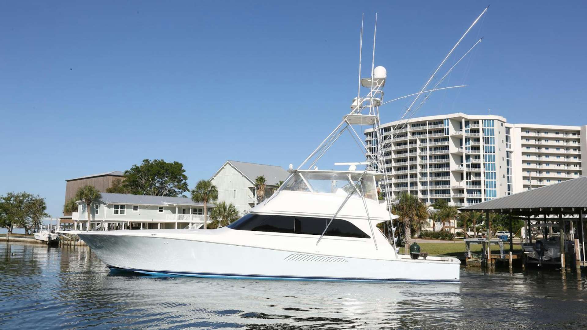 a white boat in a body of water aboard LUCILLE Yacht for Sale