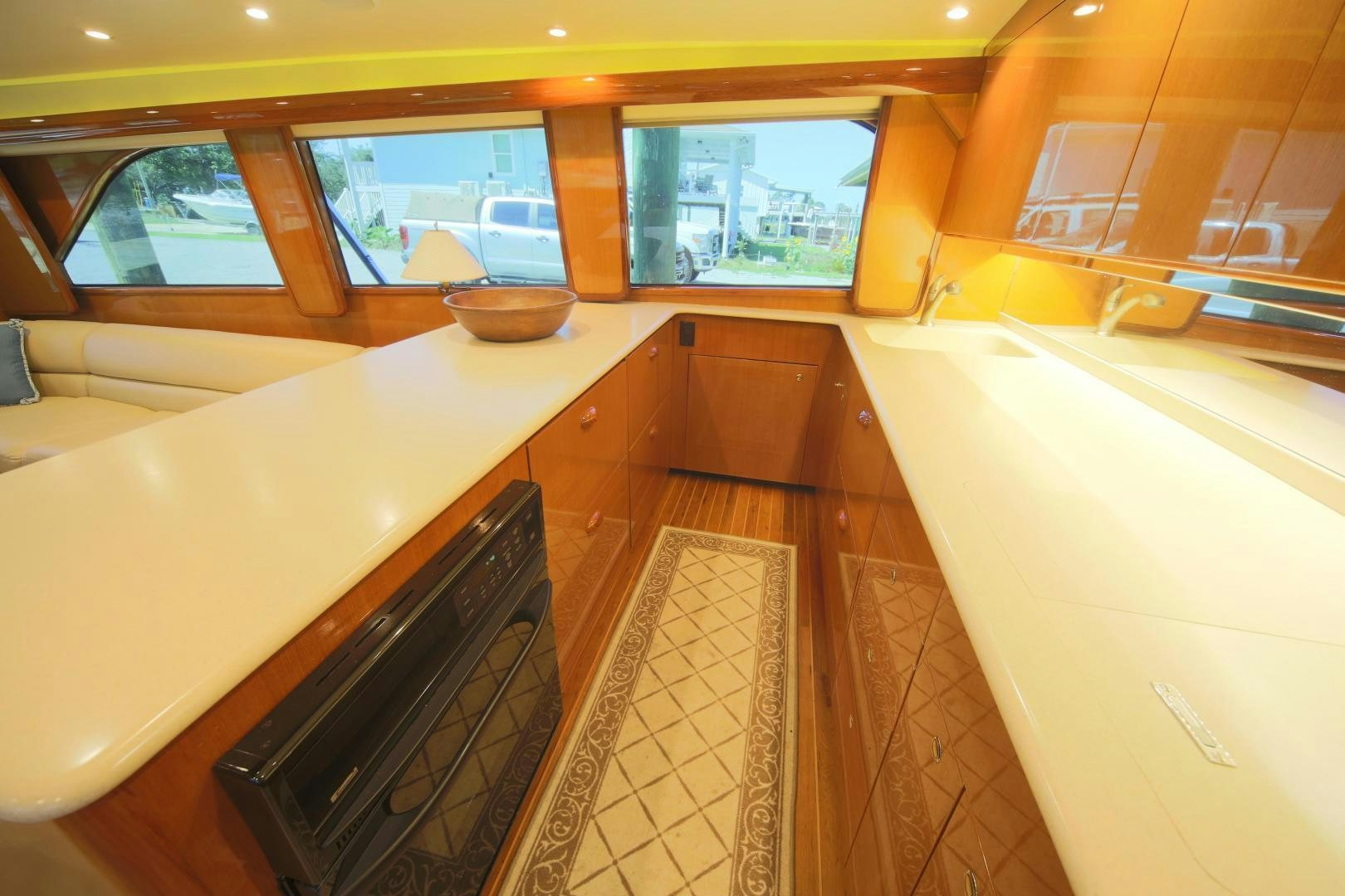 a kitchen with a black microwave aboard LUCILLE Yacht for Sale