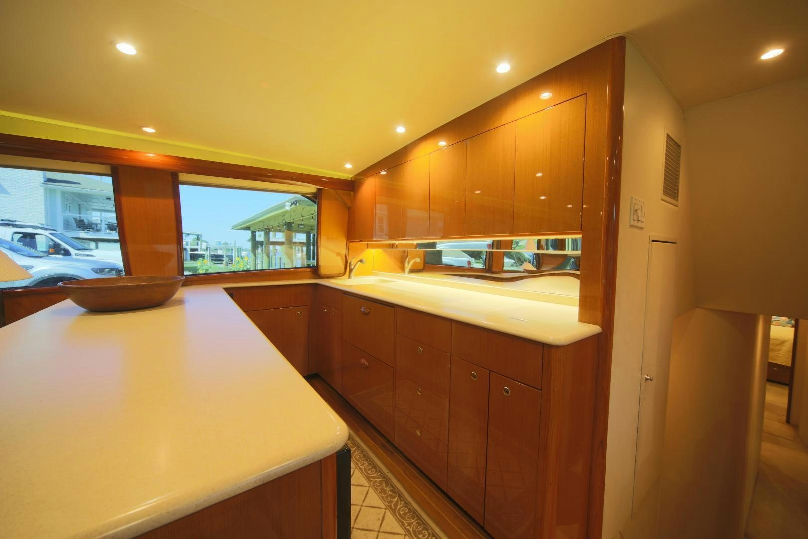 a kitchen with a large window aboard LUCILLE Yacht for Sale