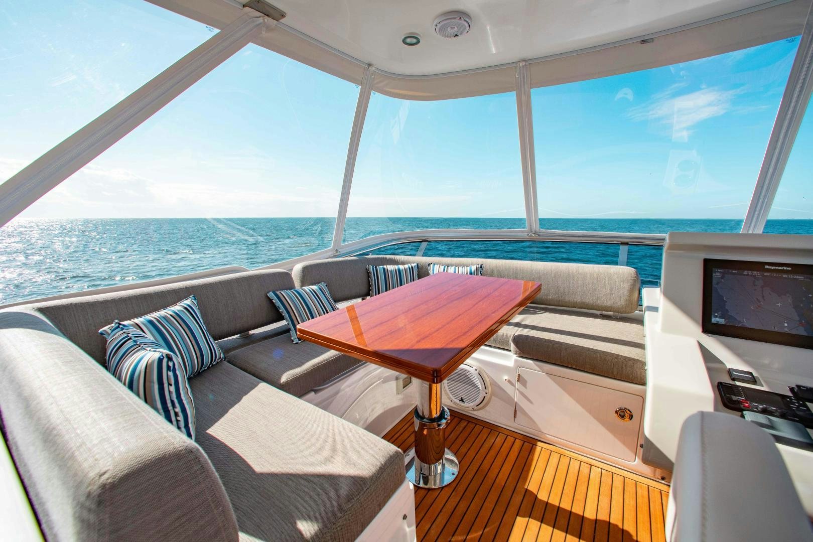 a room with a table and chairs aboard Queen Mara Yacht for Sale