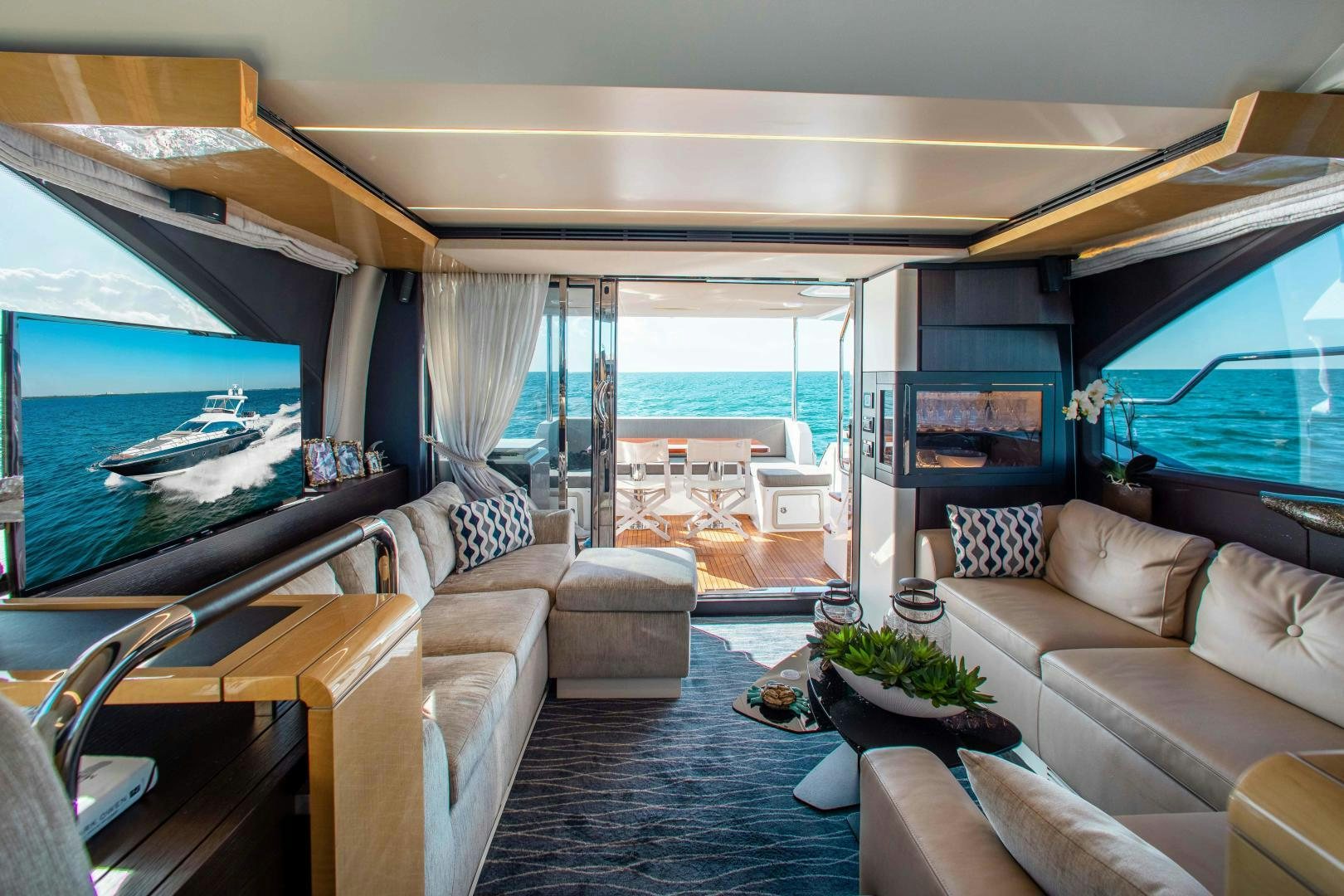 a living room with a large window aboard Queen Mara Yacht for Sale