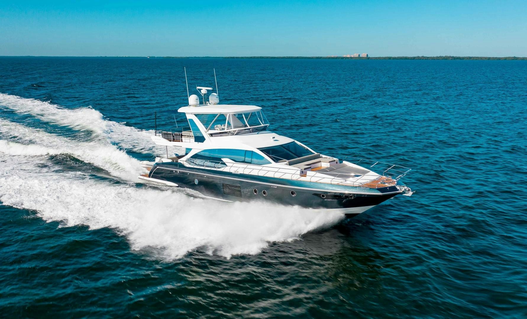 a white yacht on the water aboard Queen Mara Yacht for Sale