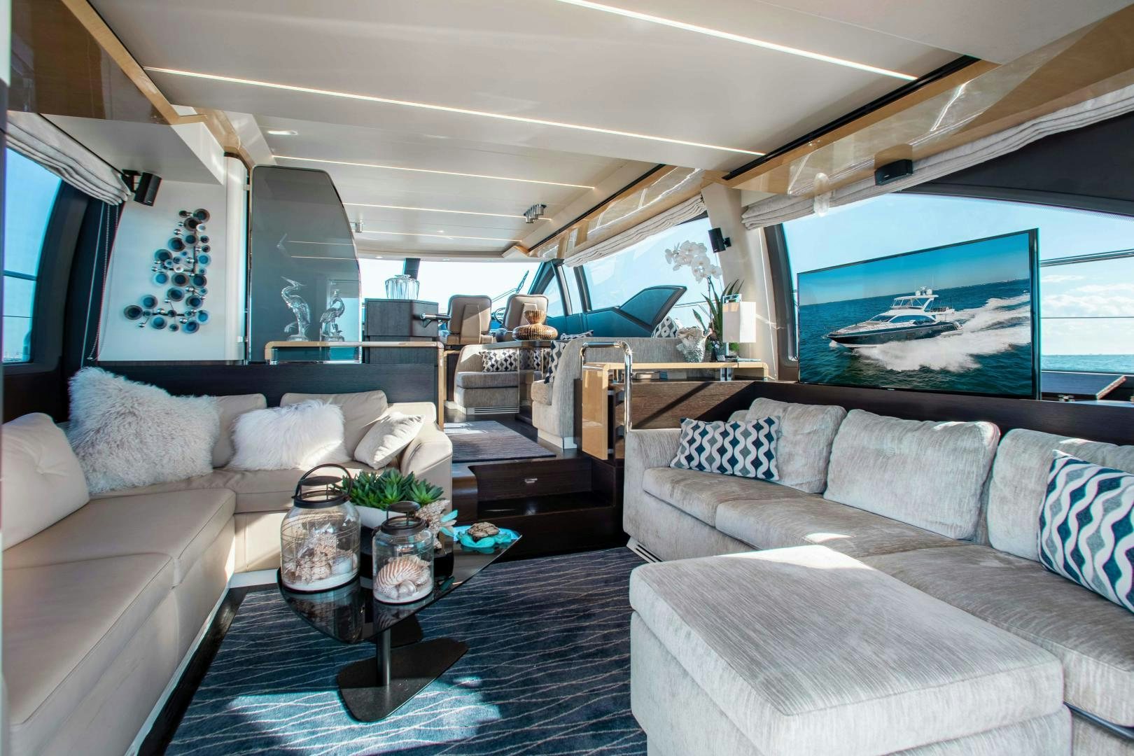 a living room with a couch and a table aboard Queen Mara Yacht for Sale