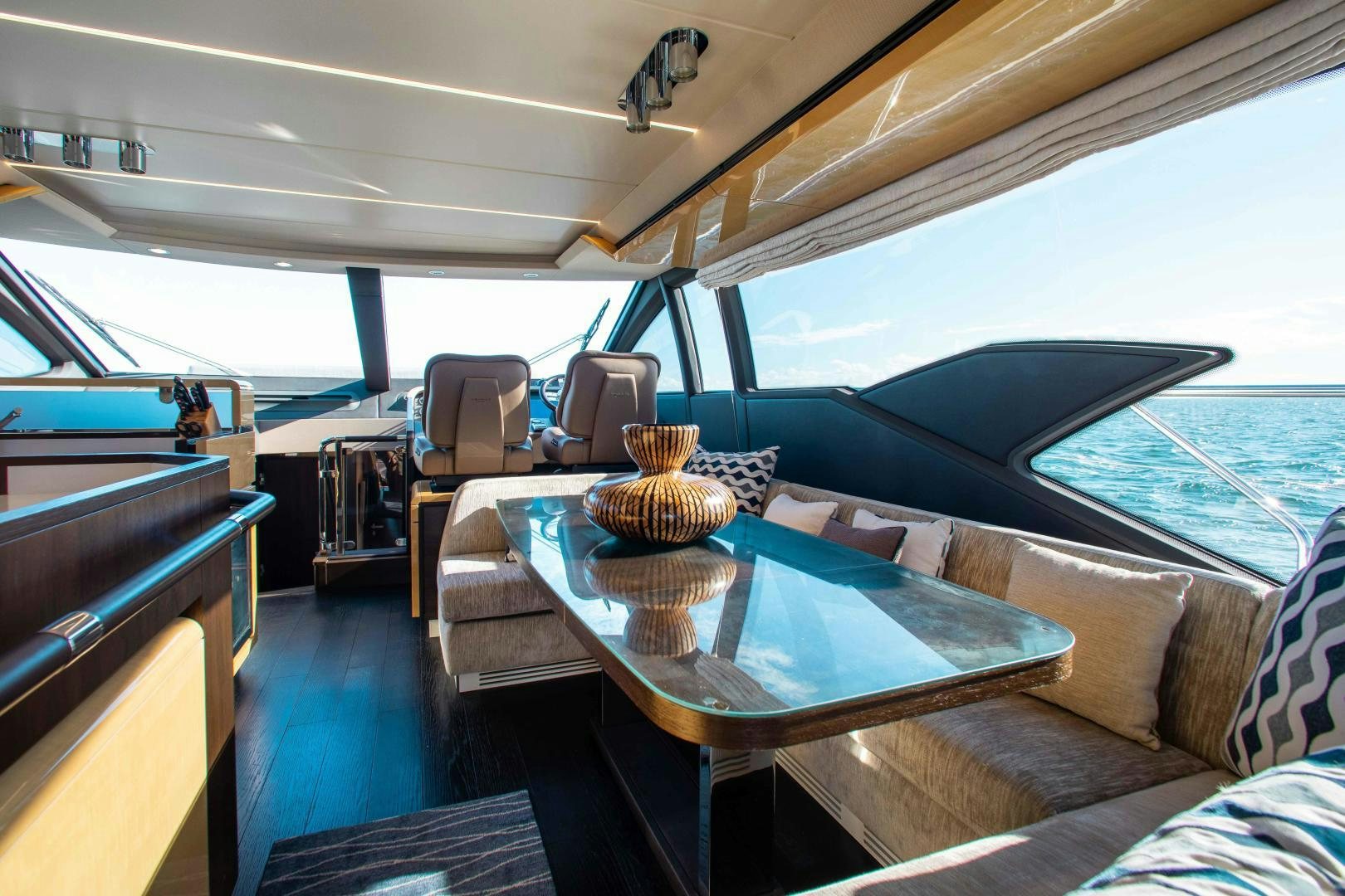 a boat with a table and chairs aboard Queen Mara Yacht for Sale