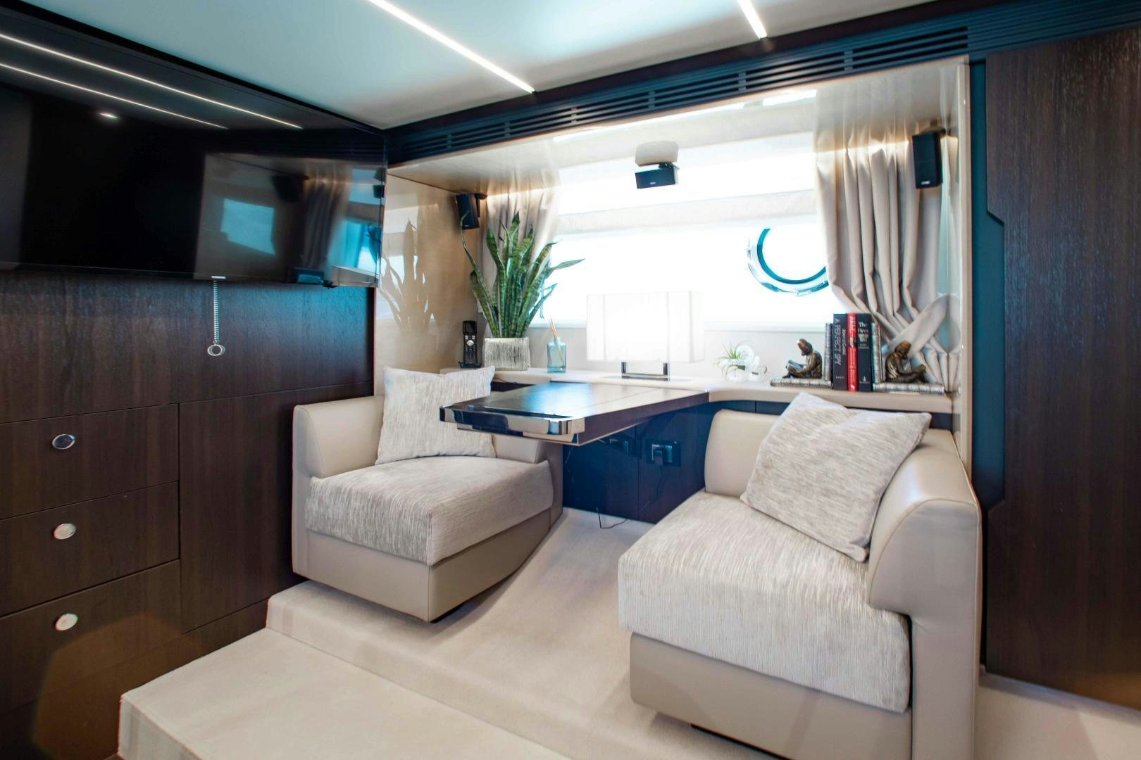 a room with a couch and a table aboard Queen Mara Yacht for Sale