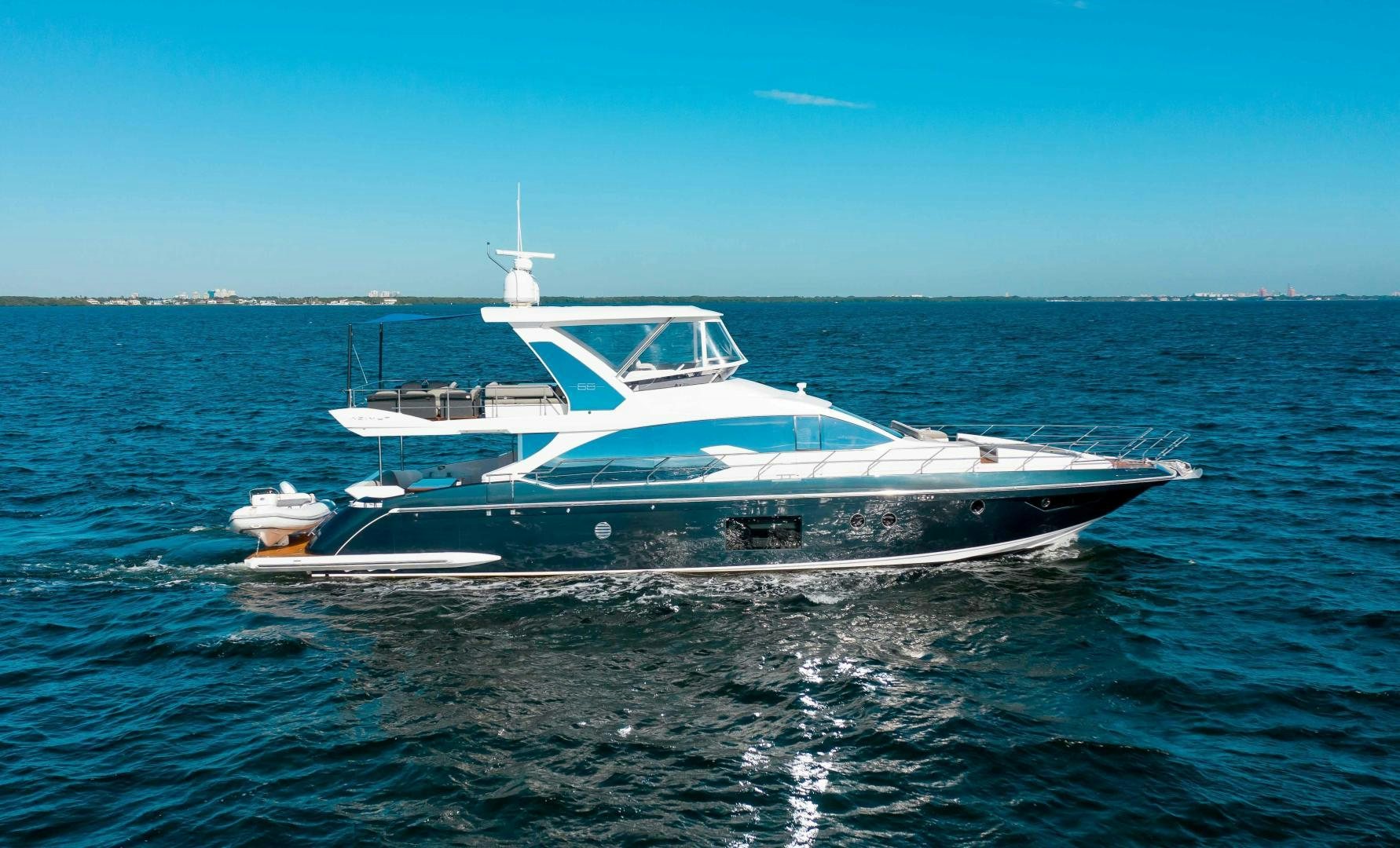 a white yacht in the water aboard Queen Mara Yacht for Sale