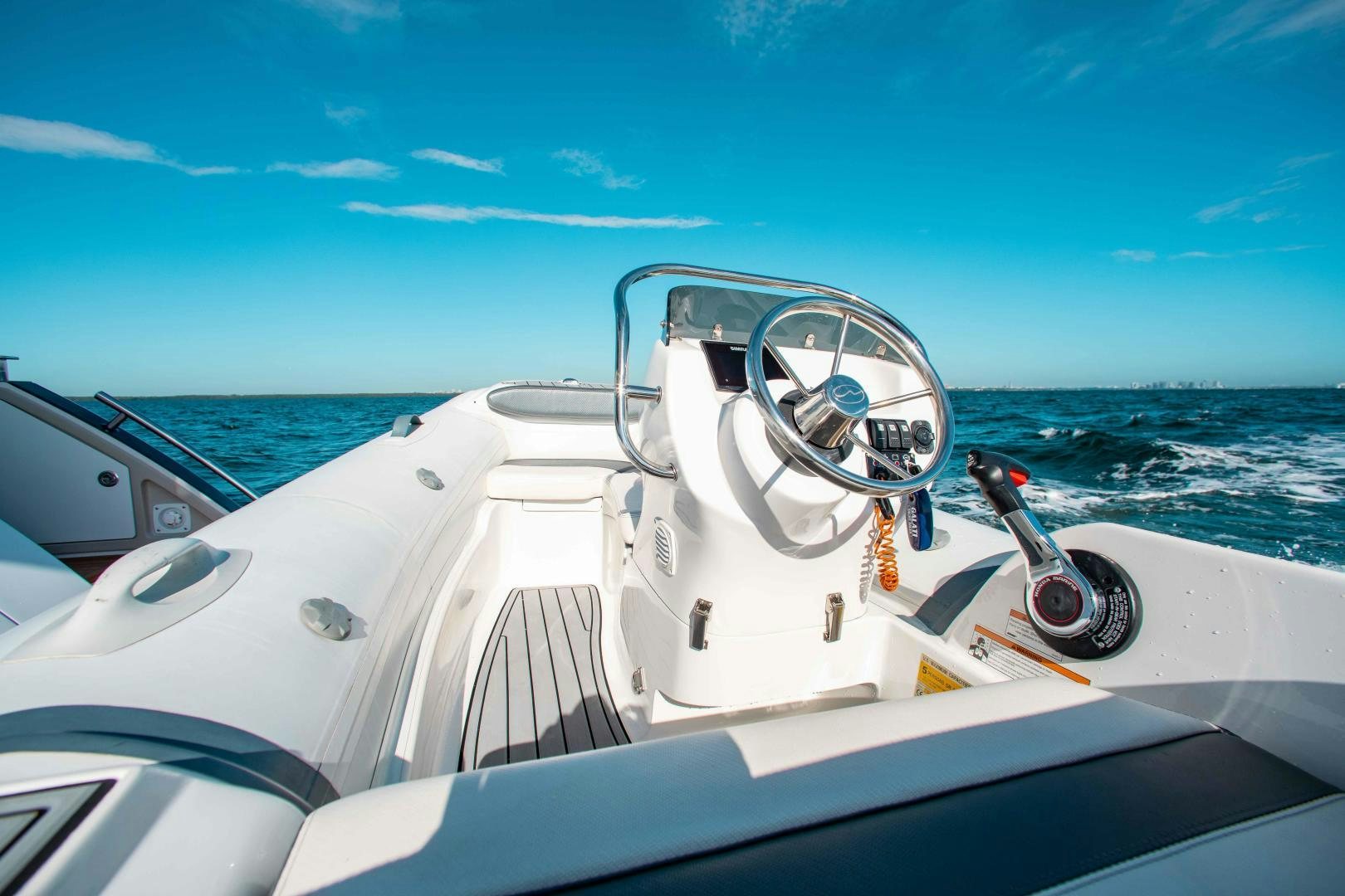 the steering wheel of a boat aboard Queen Mara Yacht for Sale