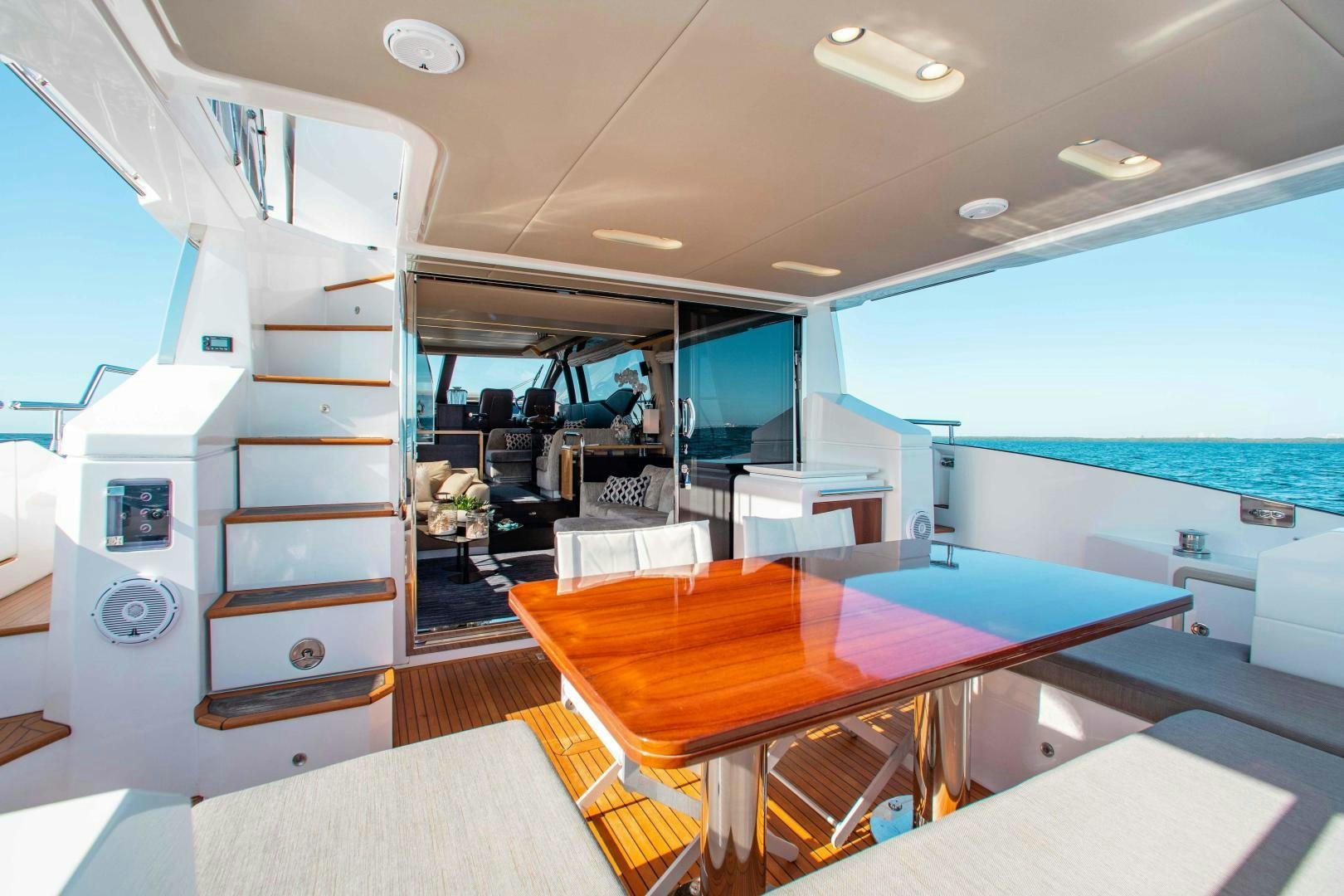 a room with a table and chairs aboard Queen Mara Yacht for Sale