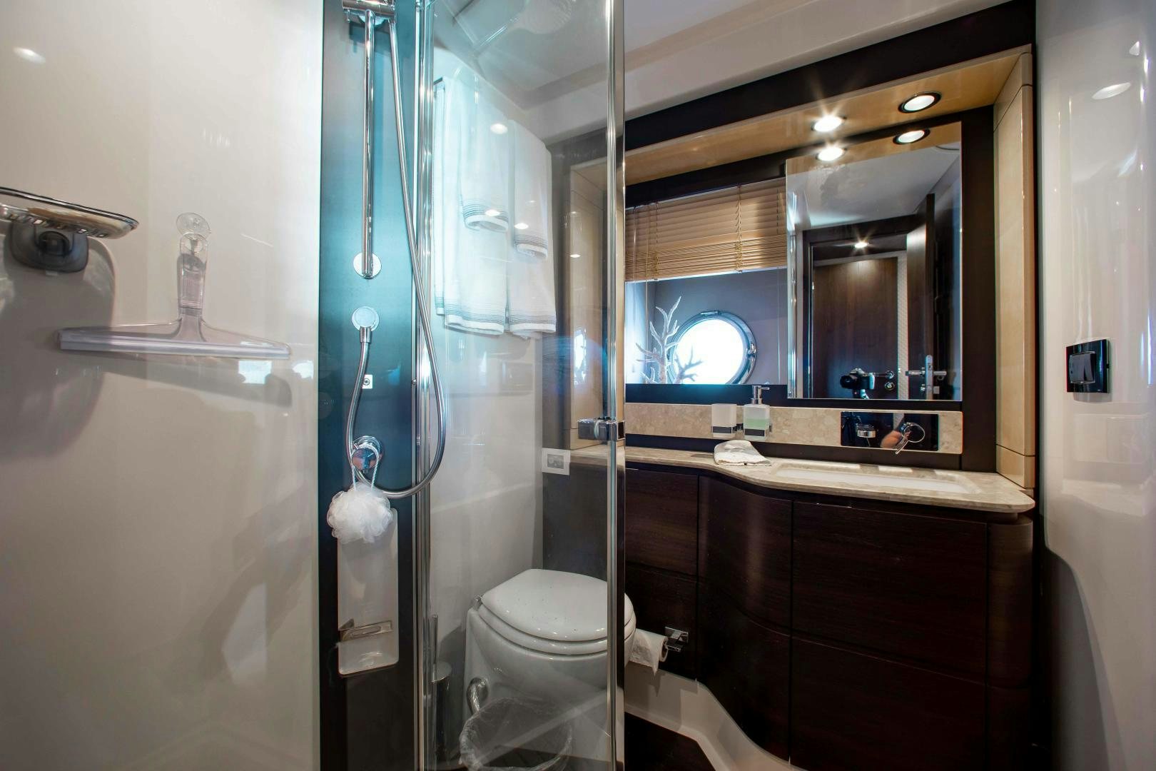 a bathroom with a glass shower aboard Queen Mara Yacht for Sale