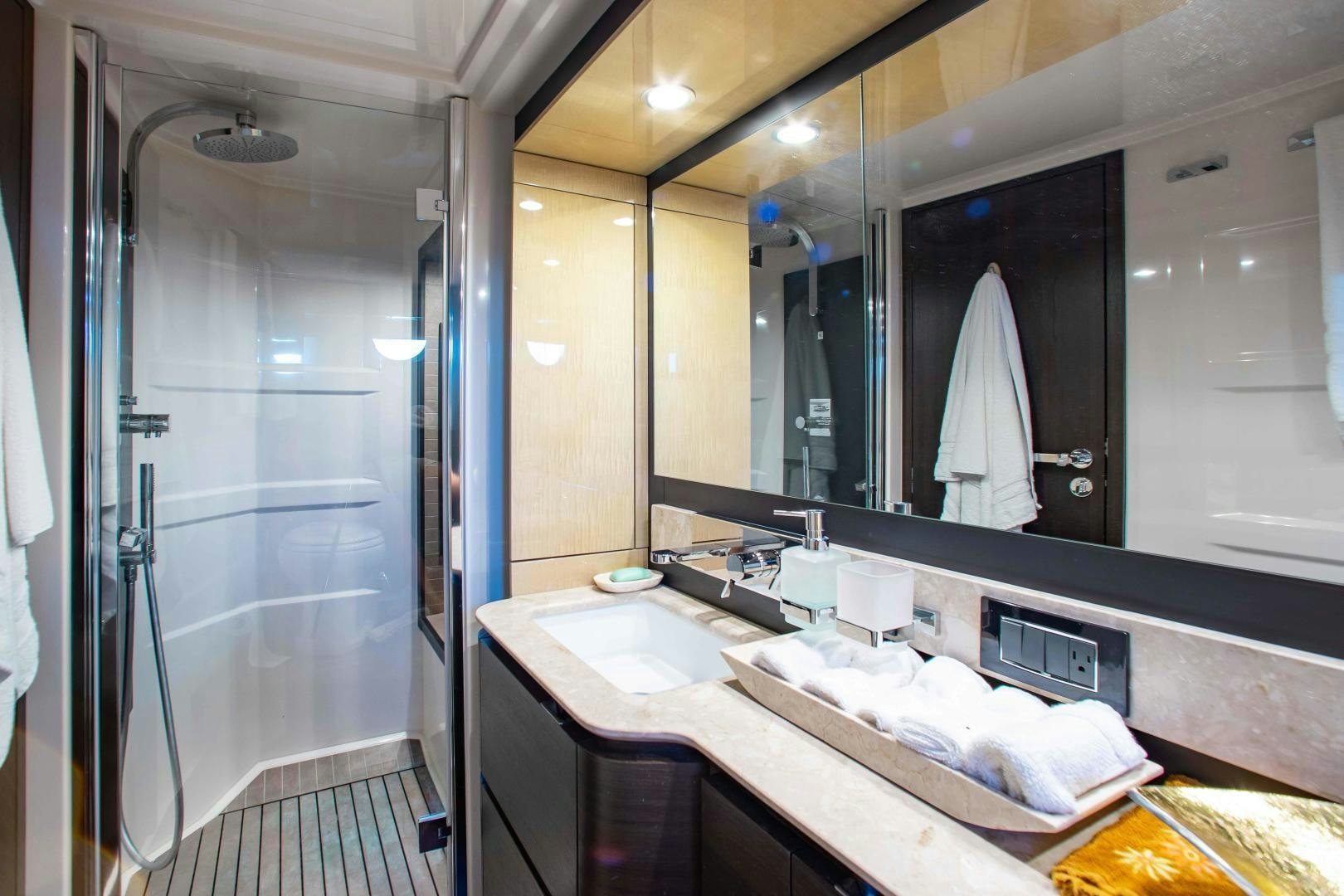 a bathroom with a large mirror aboard Queen Mara Yacht for Sale