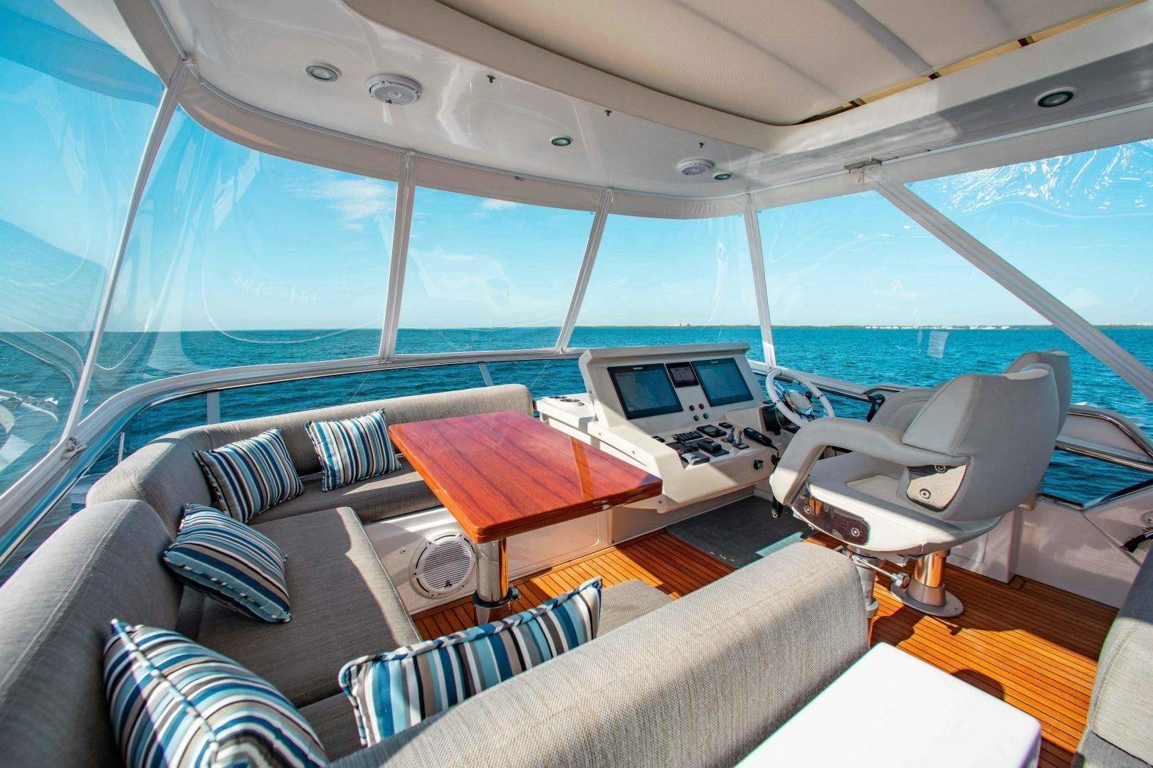 inside of a tent with a couch and a laptop on the table aboard Queen Mara Yacht for Sale