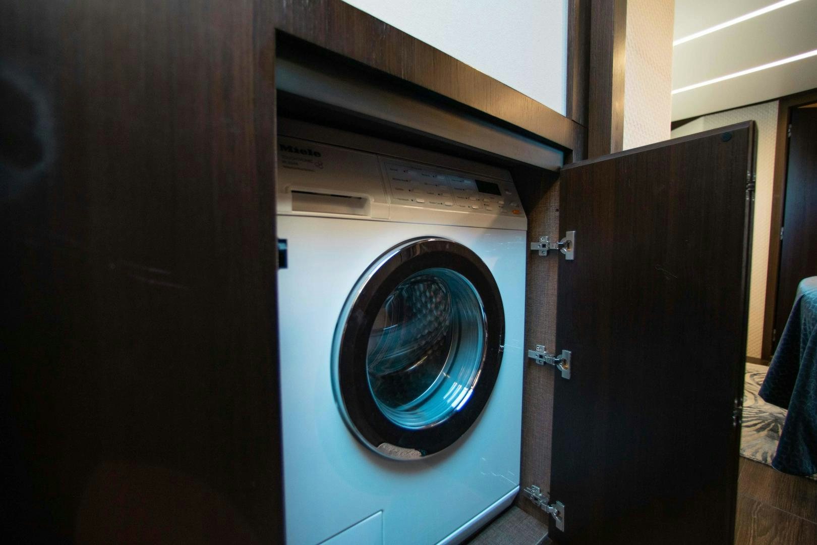 a washing machine in a room aboard Queen Mara Yacht for Sale