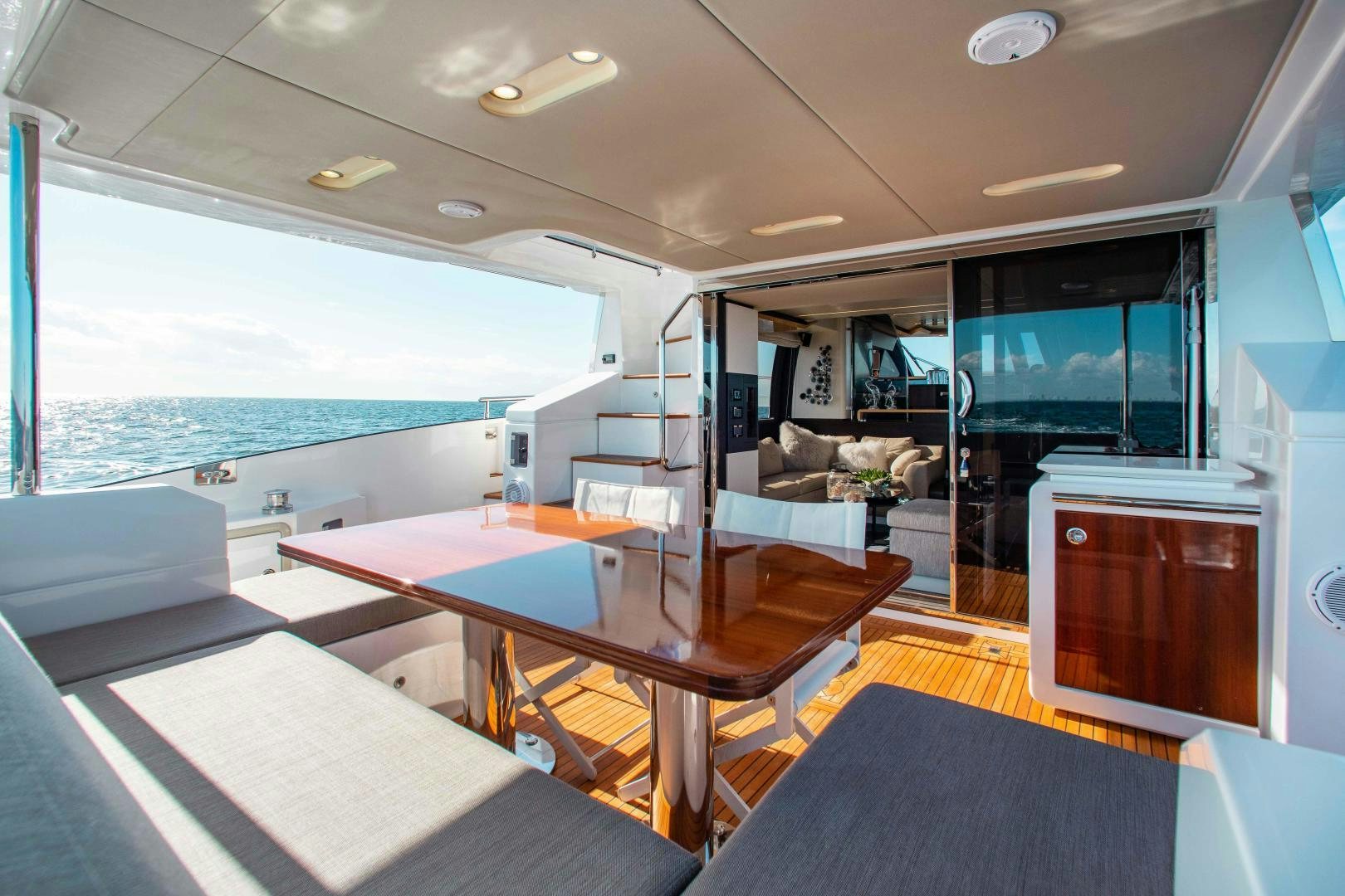 a room with a table and chairs aboard Queen Mara Yacht for Sale