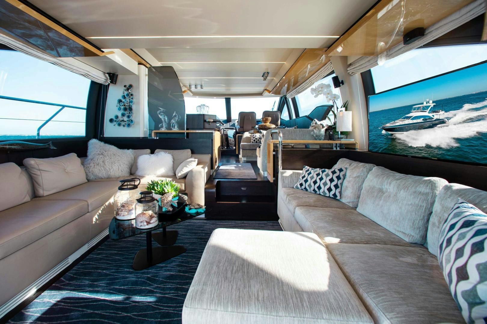 a living room with a large sofa aboard Queen Mara Yacht for Sale