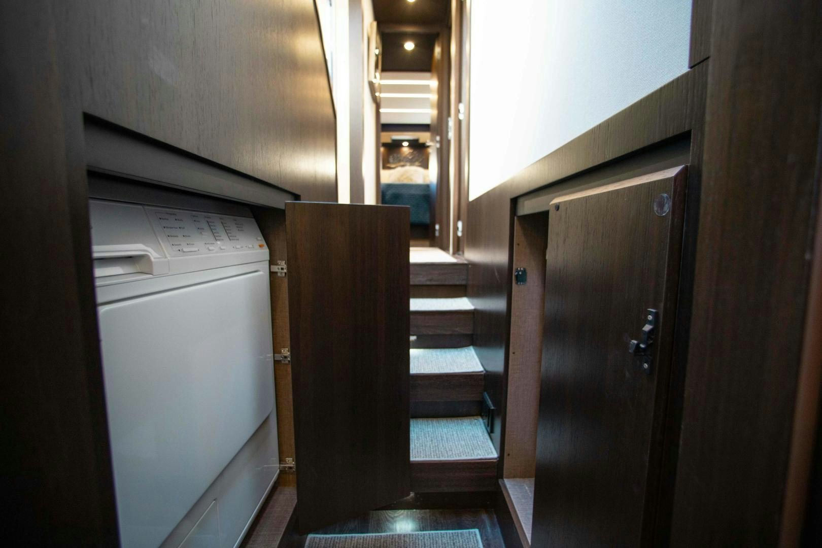 a room with wooden cabinets aboard Queen Mara Yacht for Sale