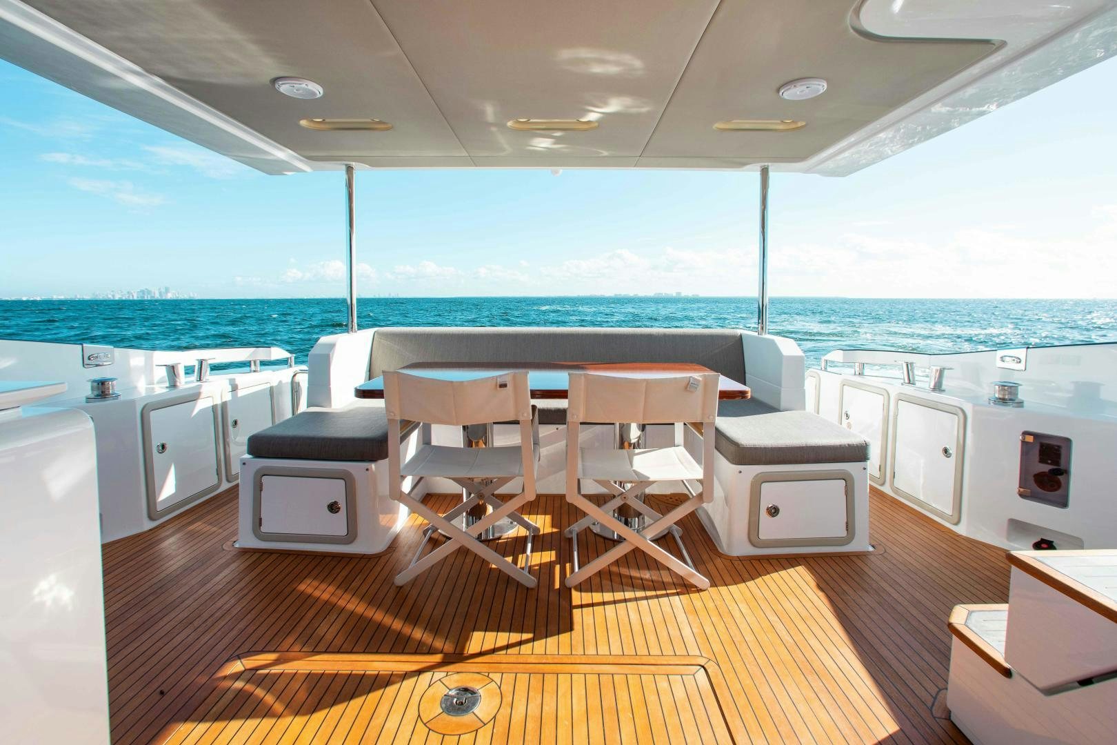 a room with a table chairs and a large window aboard Queen Mara Yacht for Sale