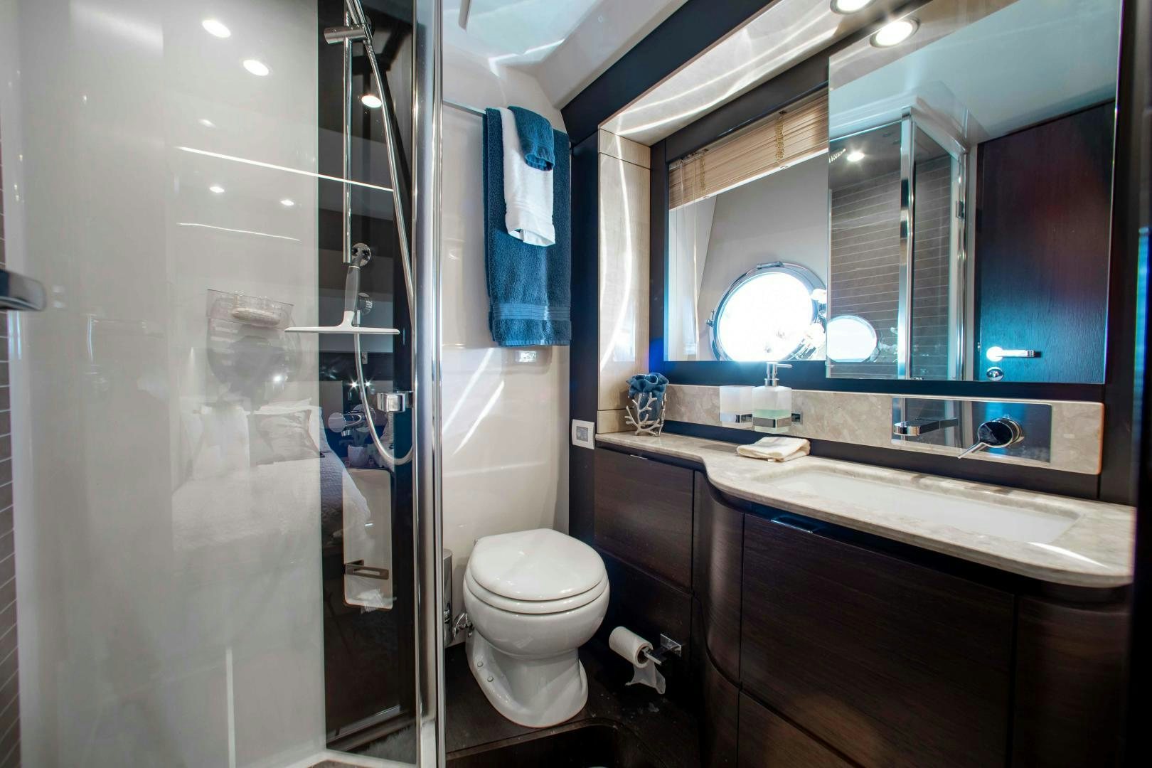 a bathroom with a glass shower aboard Queen Mara Yacht for Sale