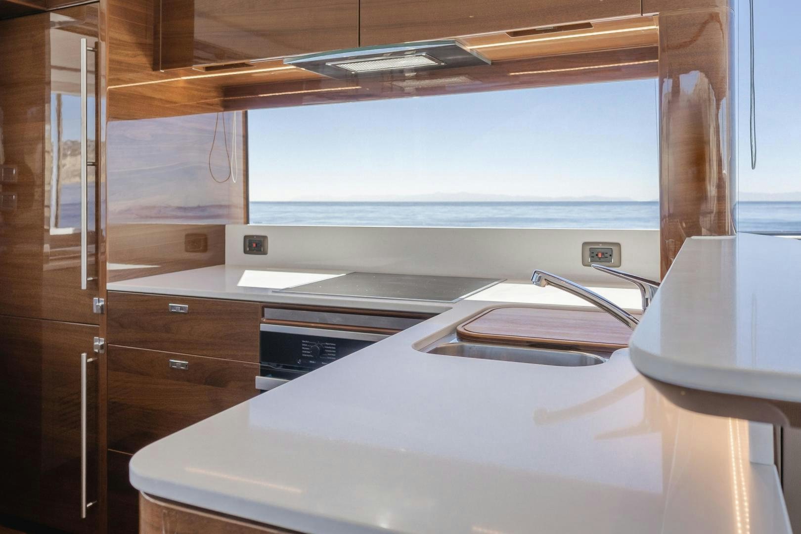 a kitchen with a large window aboard Mad Betty 2.0 Yacht for Sale