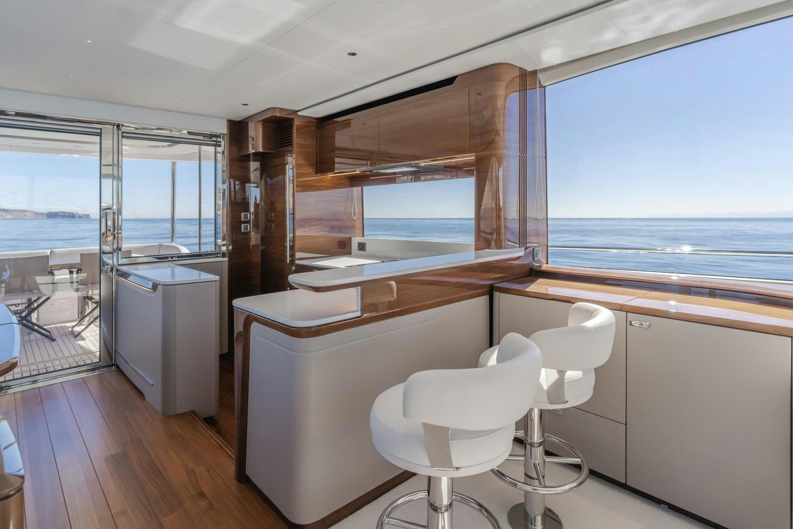 a room with a table and chairs aboard Mad Betty 2.0 Yacht for Sale