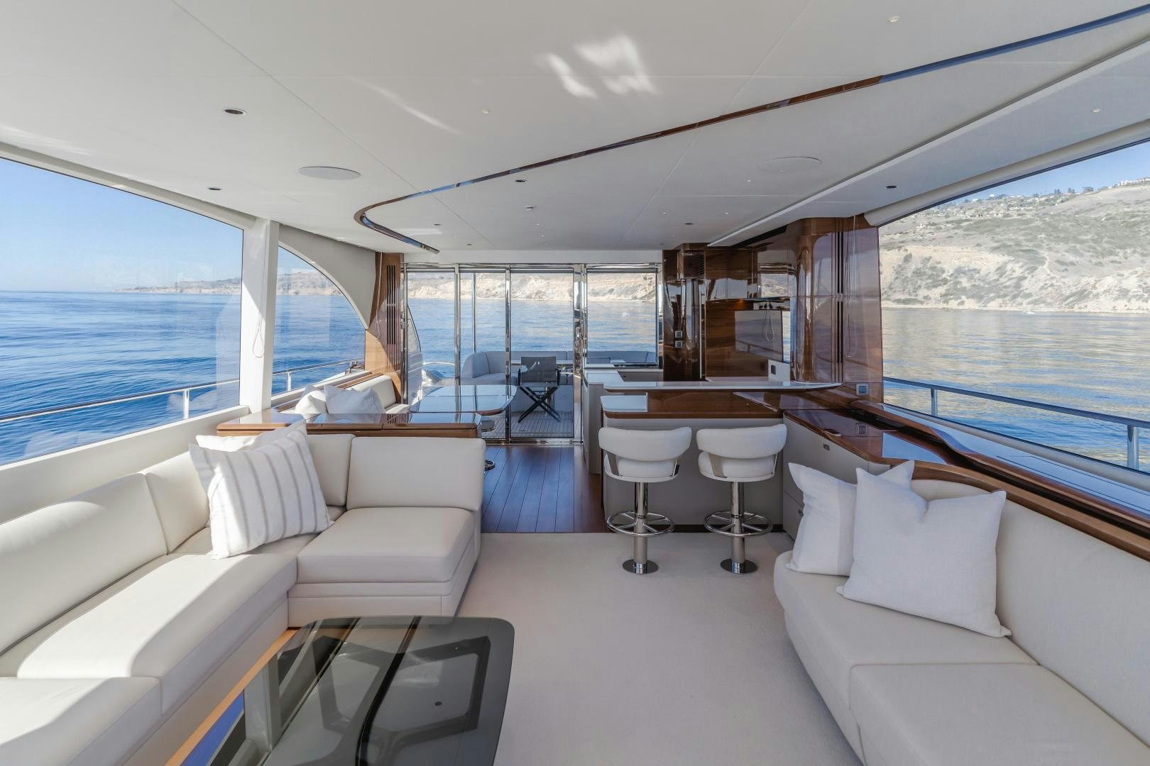 a large room with a view of the ocean and the ocean aboard Mad Betty 2.0 Yacht for Sale