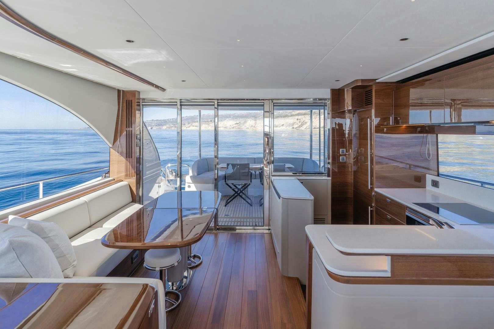 a room with a view of the ocean and the deck aboard Mad Betty 2.0 Yacht for Sale