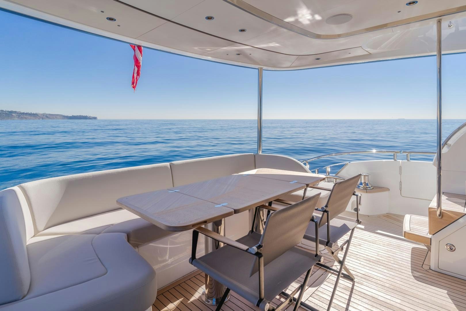 a boat with tables and chairs on a deck aboard Mad Betty 2.0 Yacht for Sale