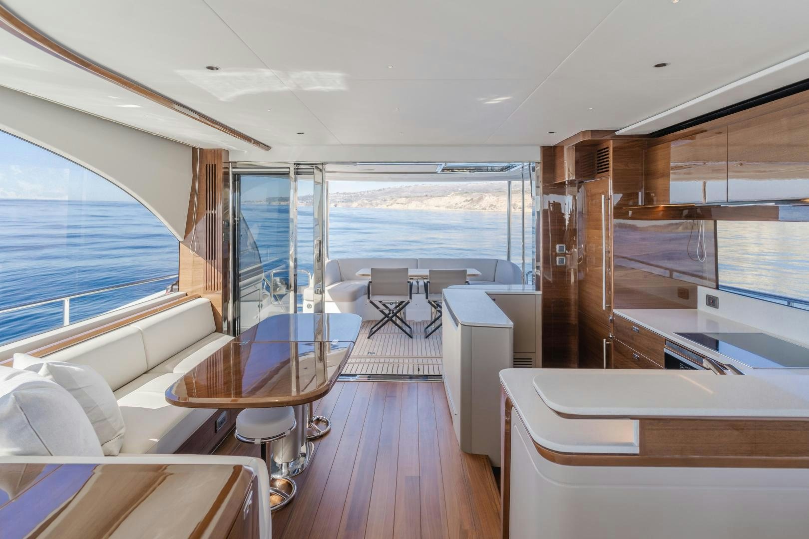 a room with a view of the ocean and the deck aboard Mad Betty 2.0 Yacht for Sale