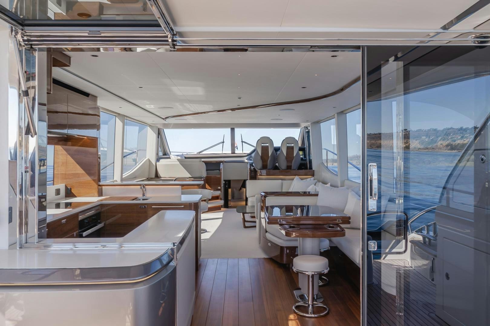 inside of a building with glass walls aboard Mad Betty 2.0 Yacht for Sale