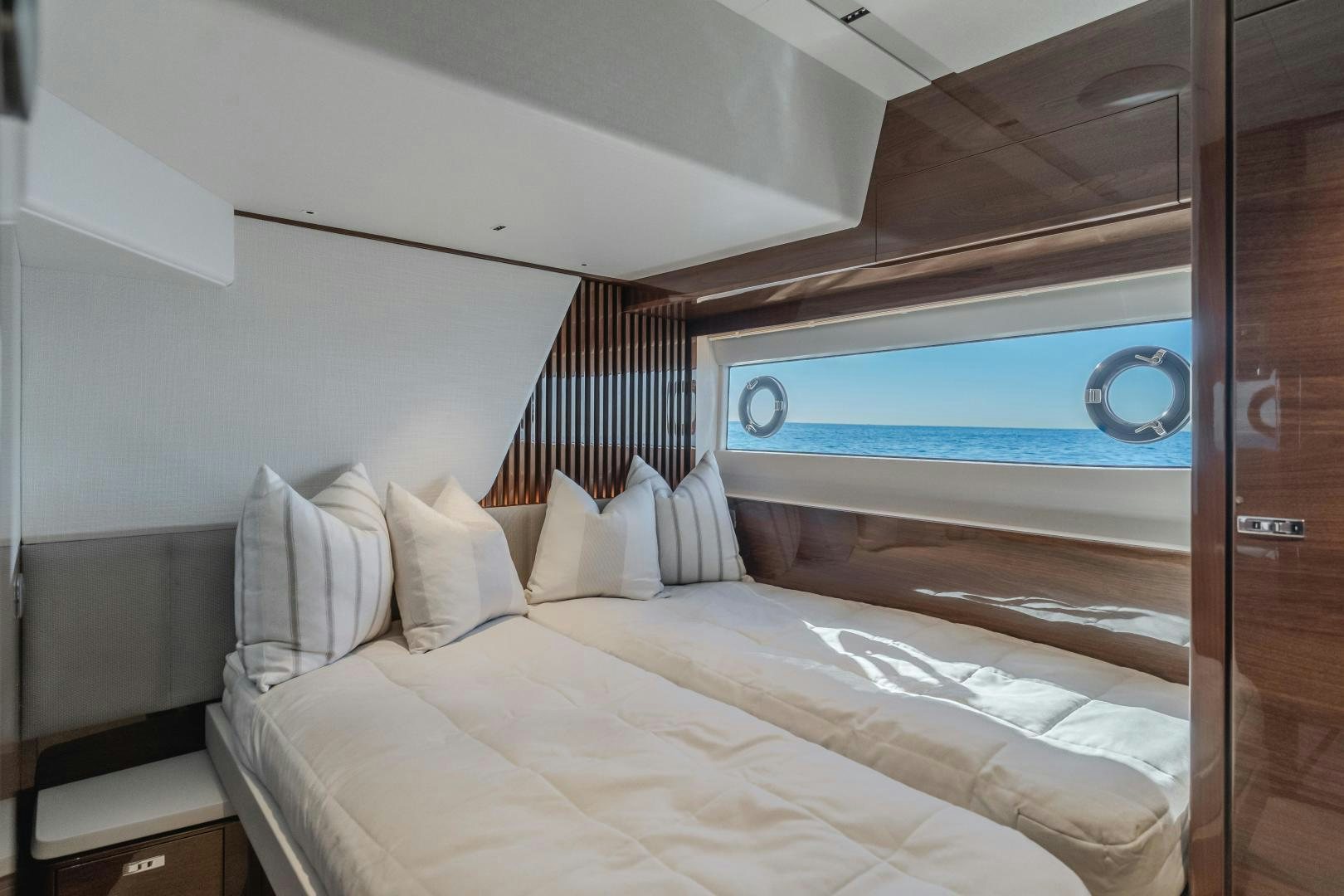 a room with a bed and a television aboard Mad Betty 2.0 Yacht for Sale