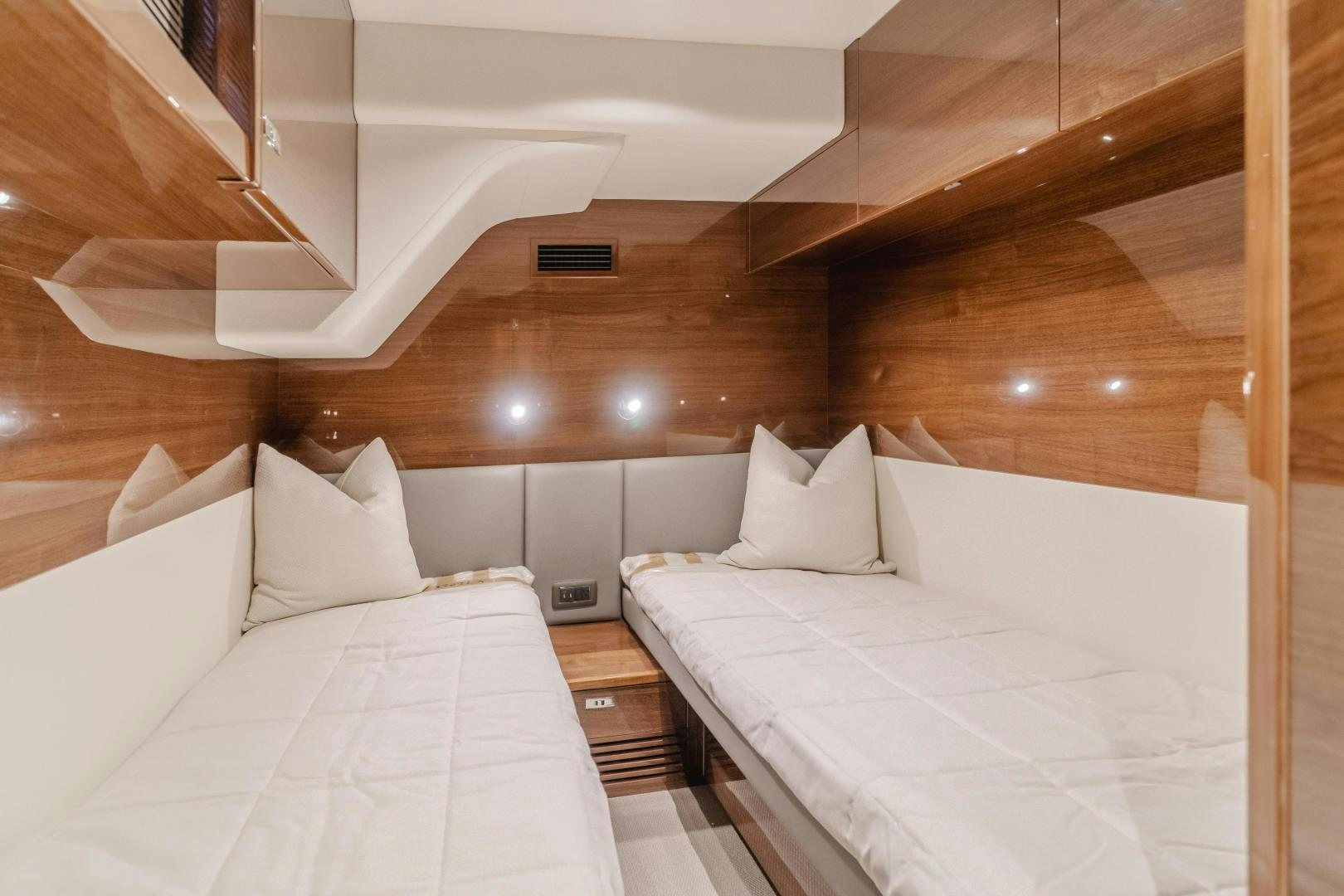 a room with two beds aboard Mad Betty 2.0 Yacht for Sale