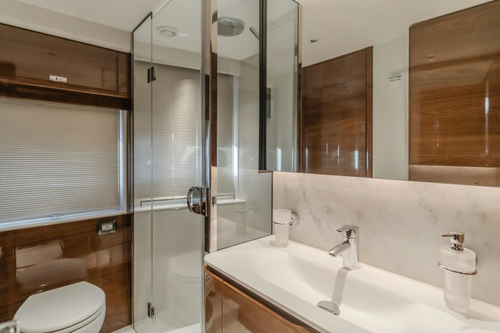 a bathroom with a glass shower aboard Mad Betty 2.0 Yacht for Sale
